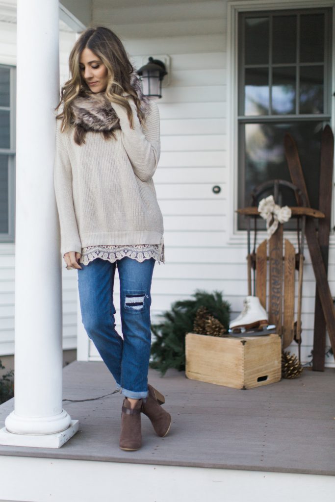 Lace trim sweater with boyfriend jeans and a faux fur scarf, winter style