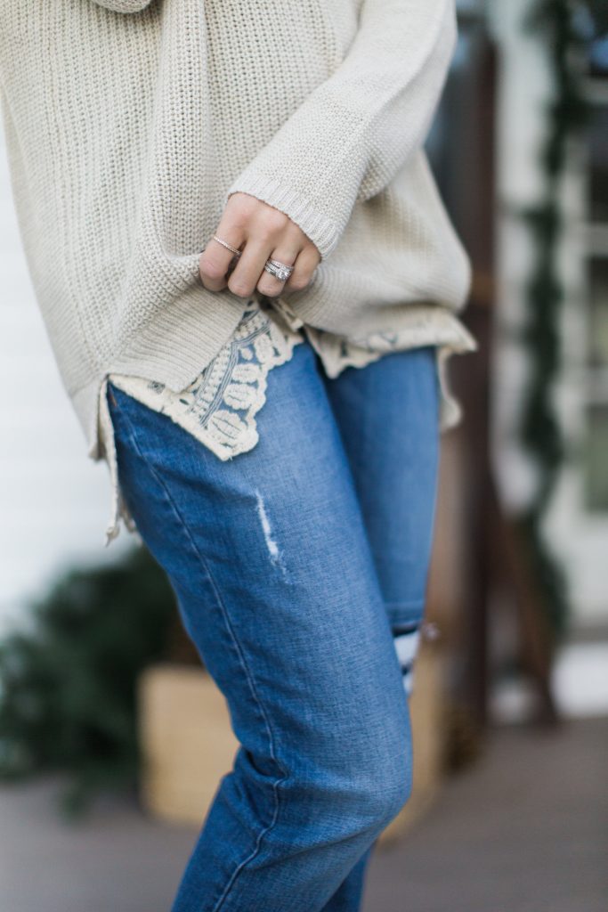 Lace trim sweater with boyfriend jeans and a faux fur scarf, winter style