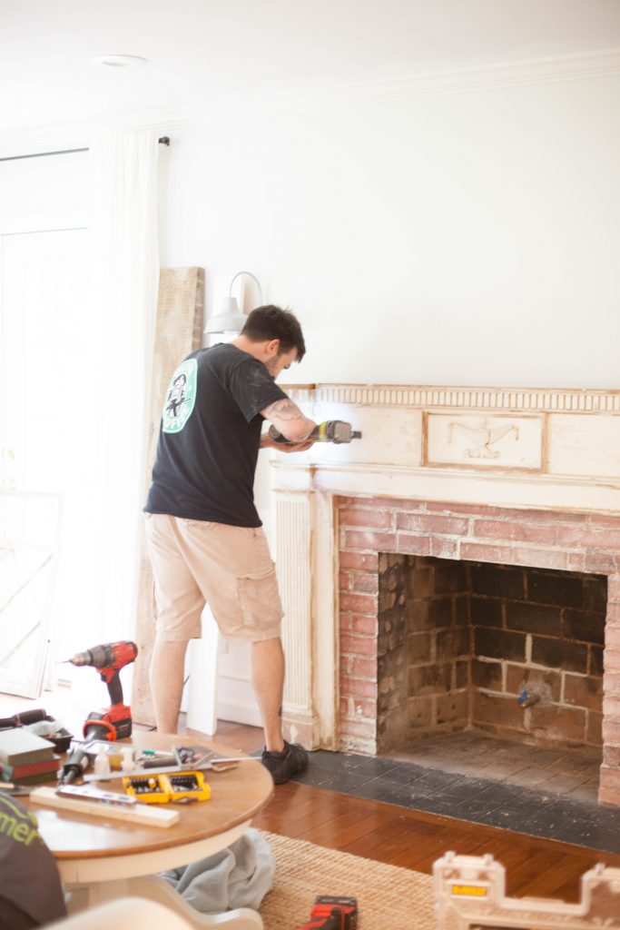 Our process for how to mount an antique mantle to our fireplace to add an antique flare to our living room.