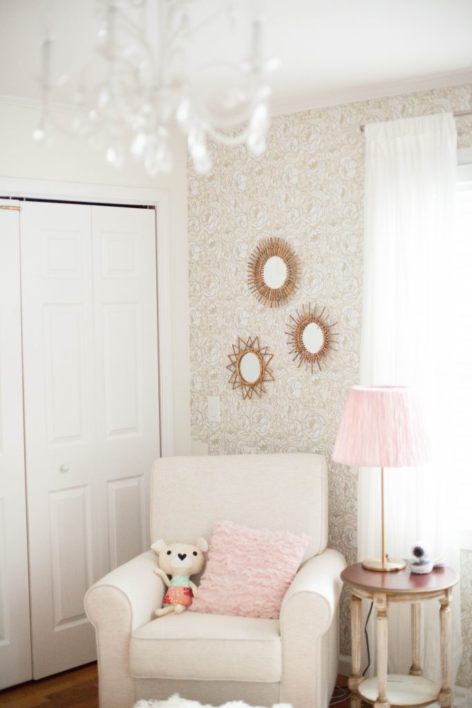 A whimsical, bohemian girl's nursery with removable wallpaper and glam accents