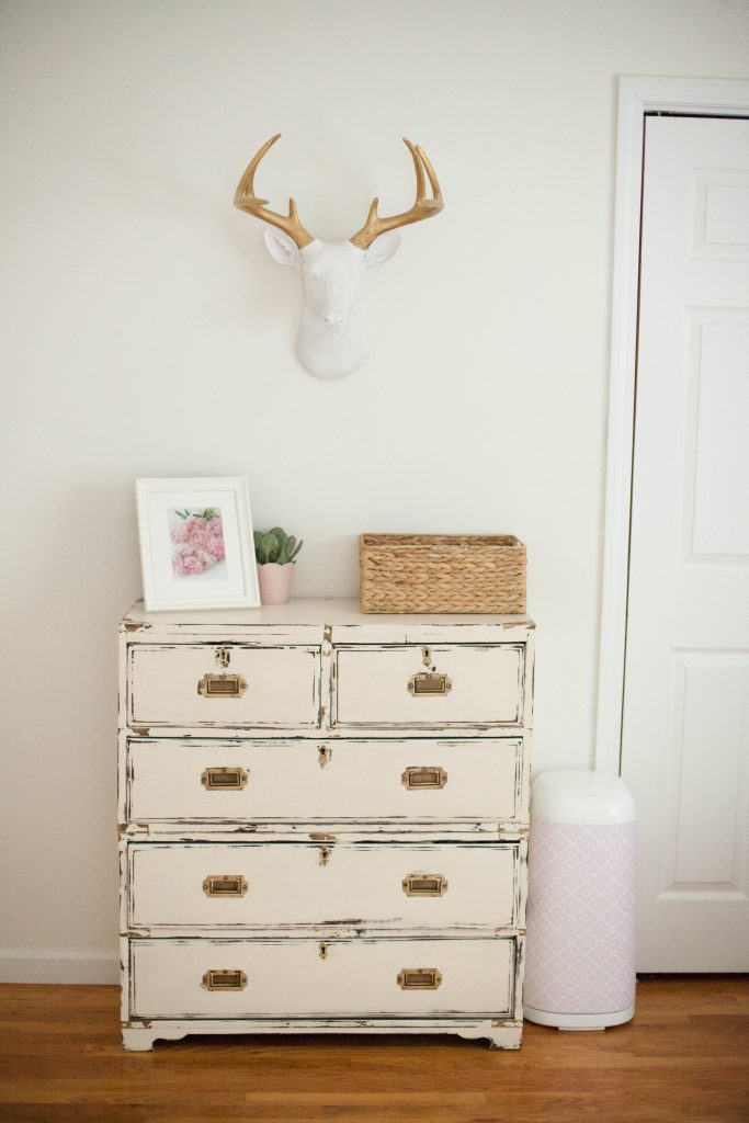 A whimsical, bohemian girl's nursery with removable wallpaper and glam accents