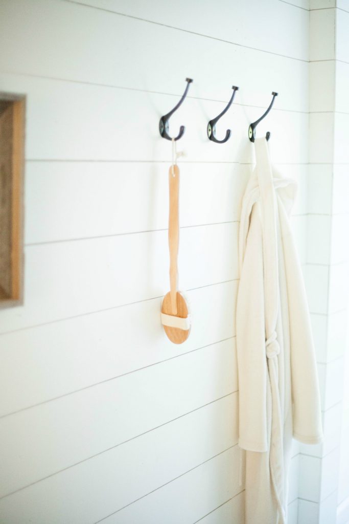 Wooden back bath brush on farmhouse hooks from World Market