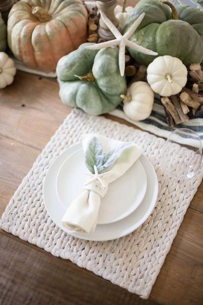 A simple coastal fall tablescape using natural elements and heirloom pumpkins for easy table decor for your fall entertaining!