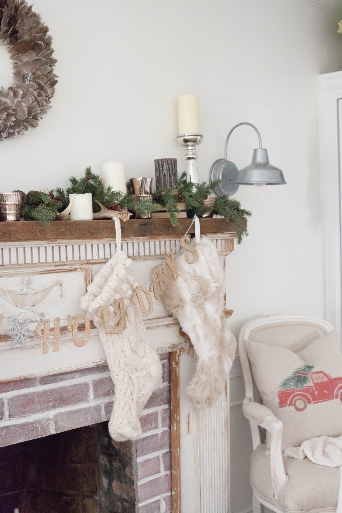 A simple and rustic farmhouse Christmas living room featuring a mixture of textures and vintage finds!