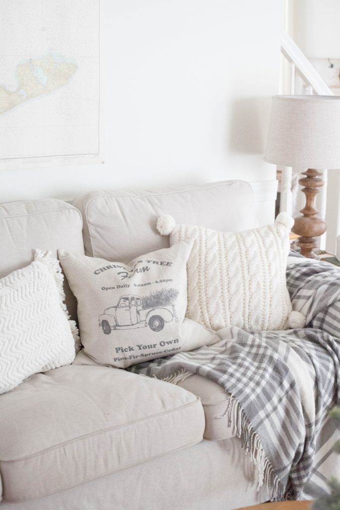 A simple and rustic farmhouse Christmas living room featuring a mixture of textures and vintage finds!