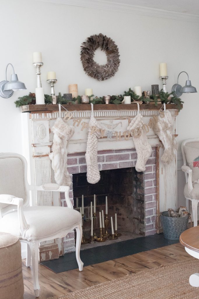 A simple and rustic farmhouse Christmas living room featuring a mixture of textures and vintage finds!