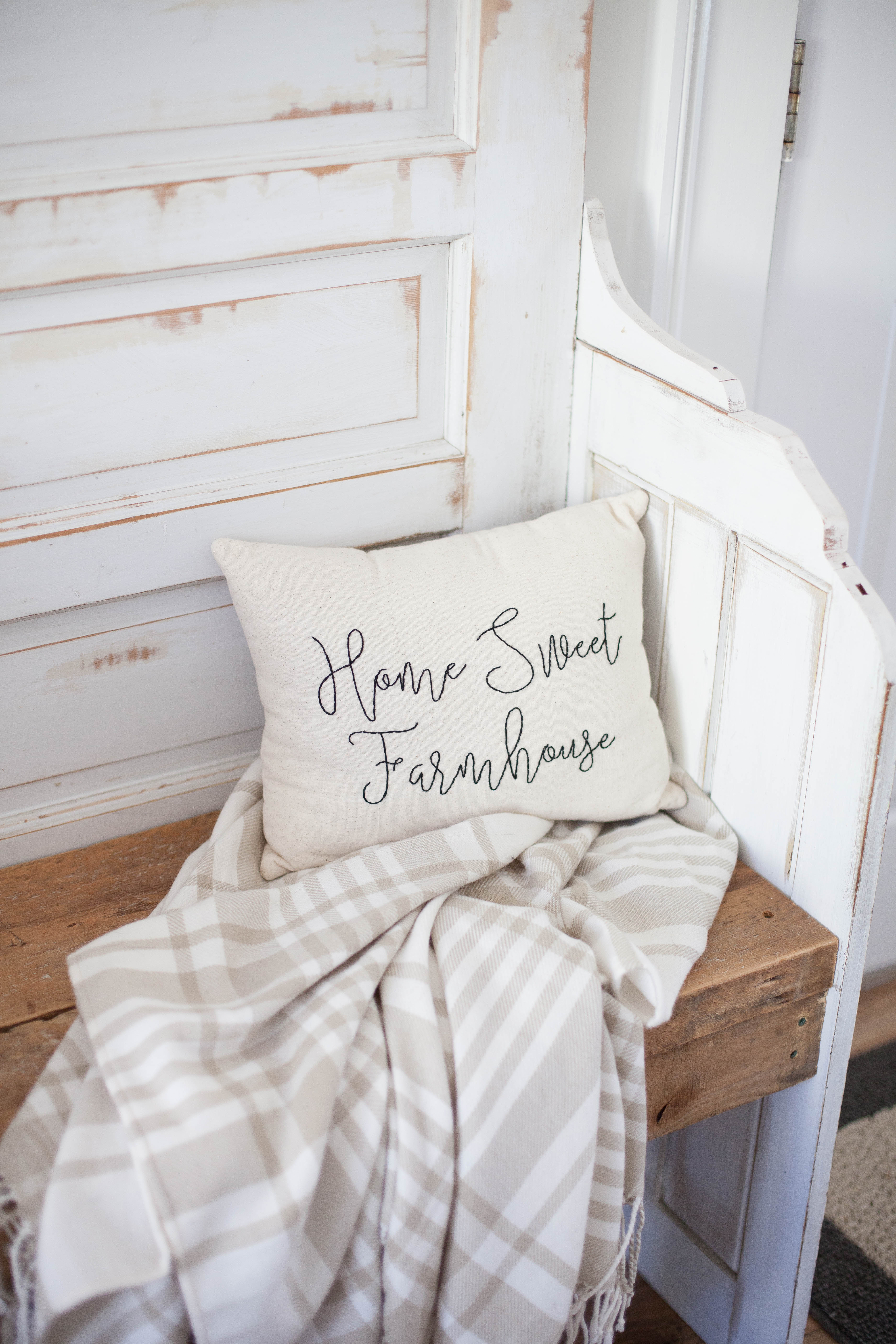 This spring cottage dining room features handmade accents like this Home Sweet Farmhouse pillow!