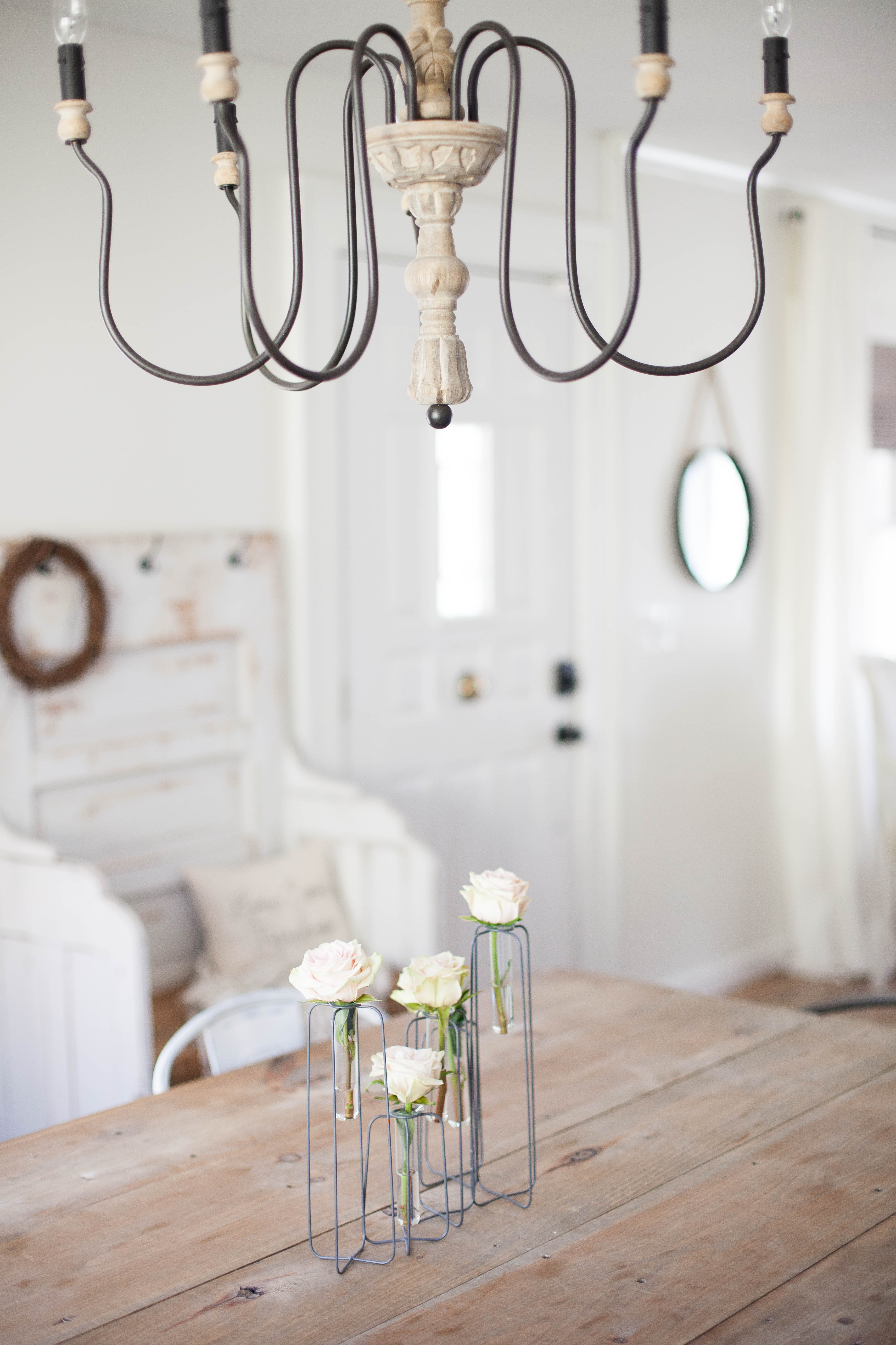 This spring cottage dining room has a minimalistic centerpiece from Magnolia Market on the handmade farm table!