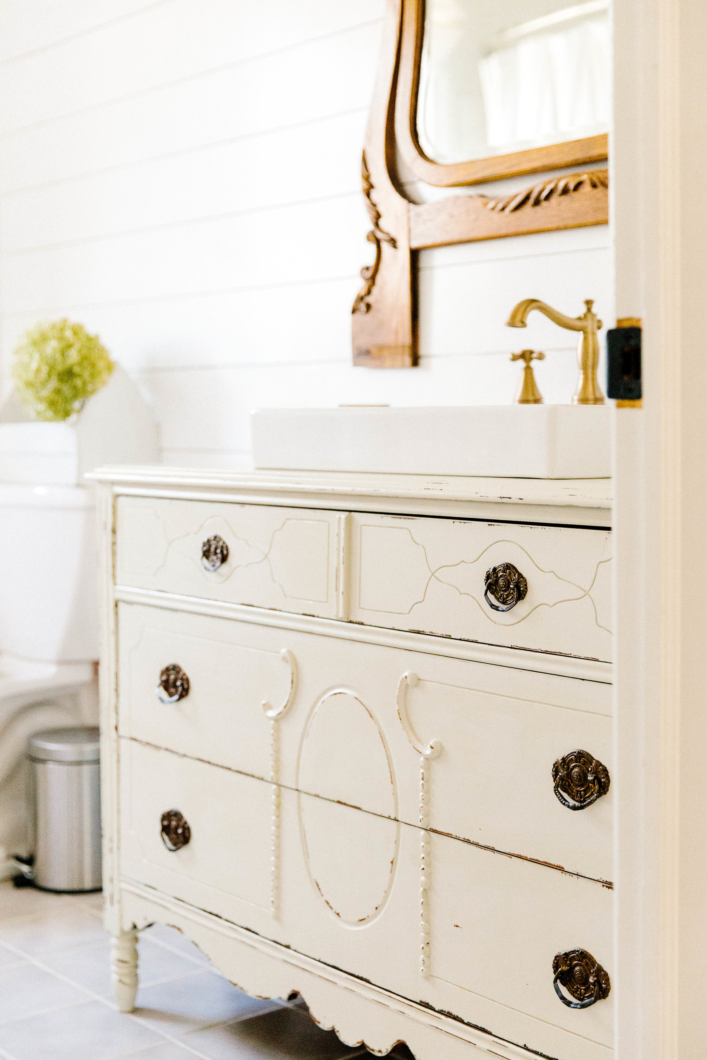 A simple tutorial on how to make a vintage dresser vanity using a vintage dresser and strategic cutting with the additional of a farmhouse sink. 