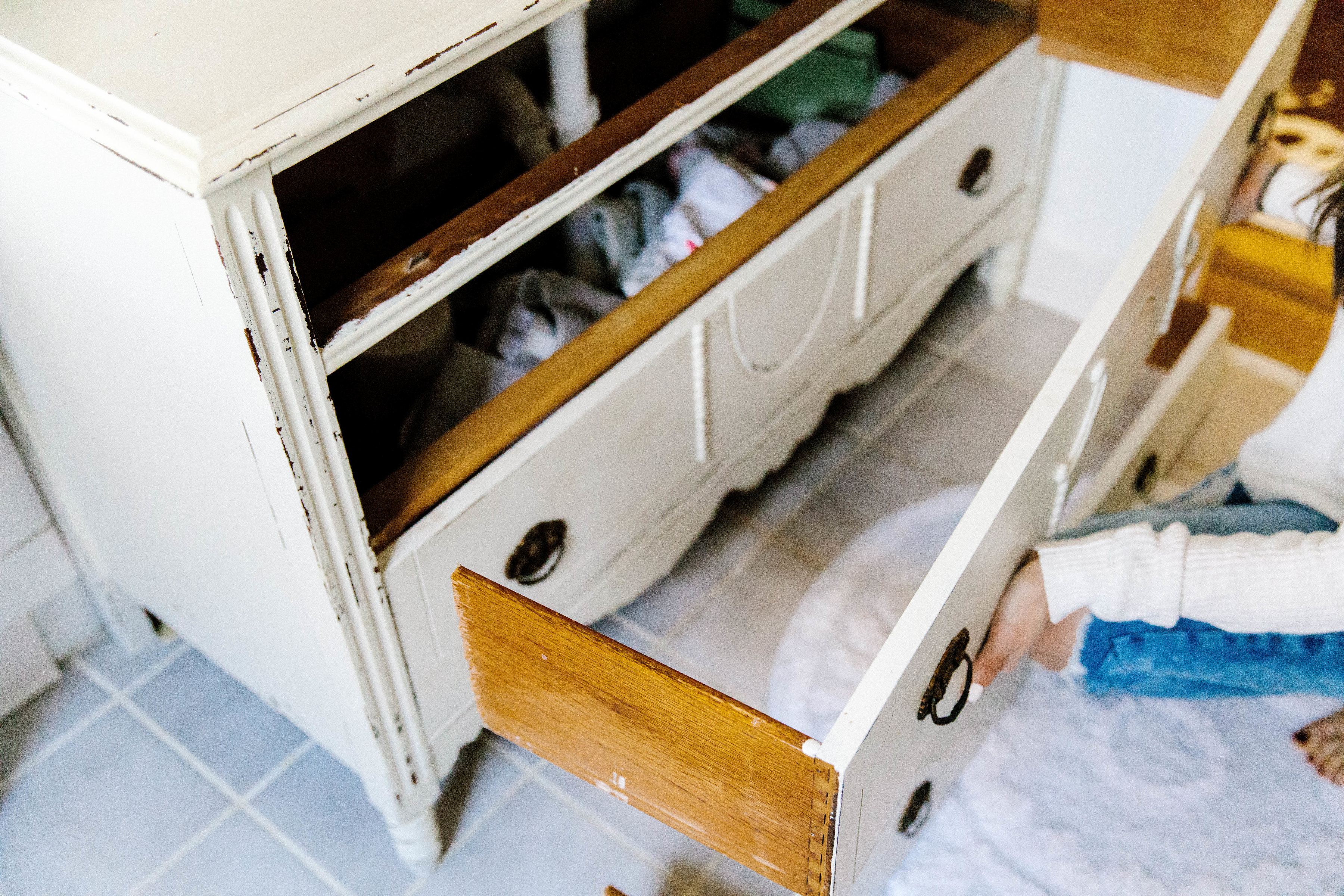 Simple cutting of a vintage dresser can easily turn it into a bathroom vanity!