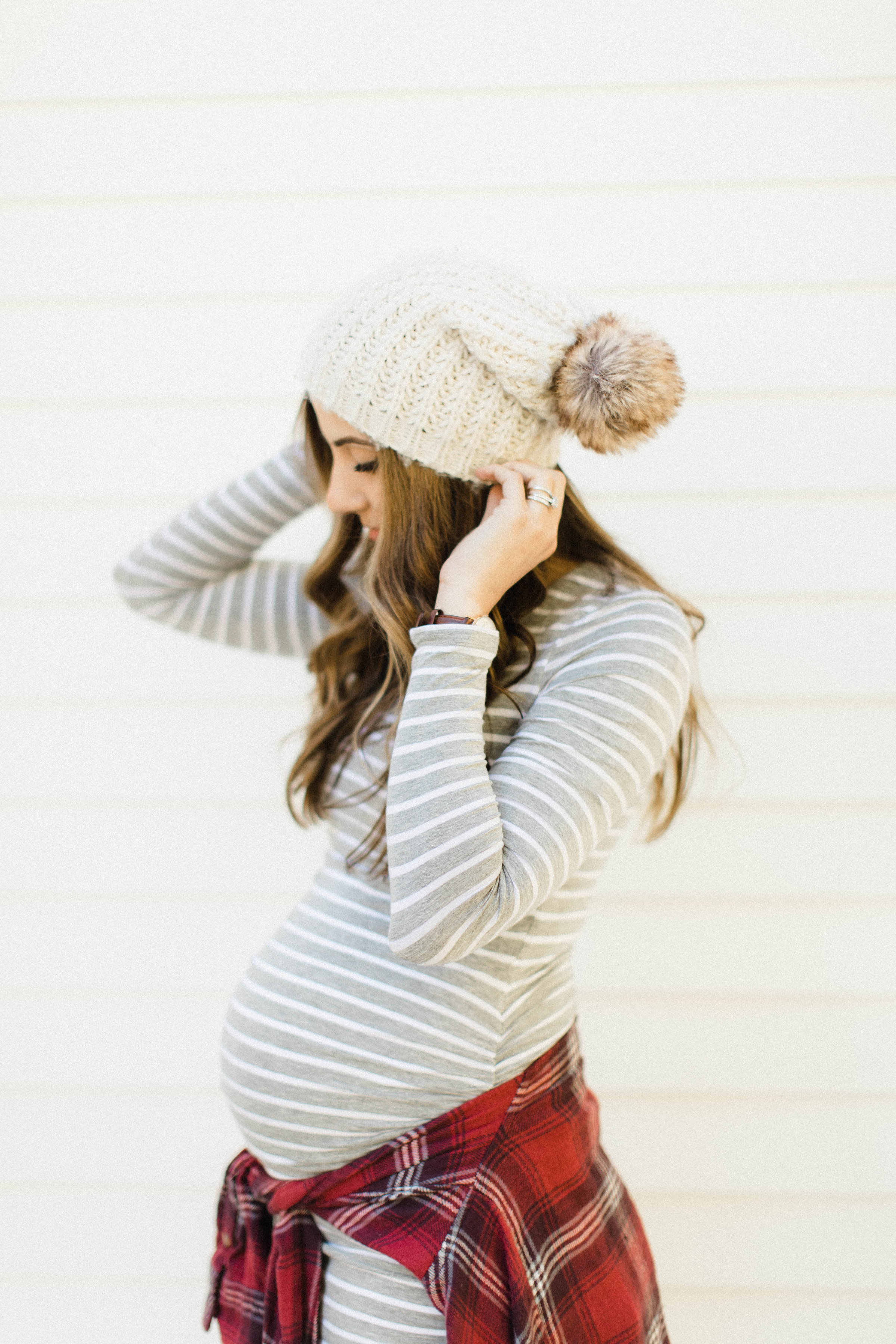 Life and style blogger Lauren McBride shares some tips on How to Style a Maternity Dress for Fall, featuring easy ways to style basic maternity dresses.