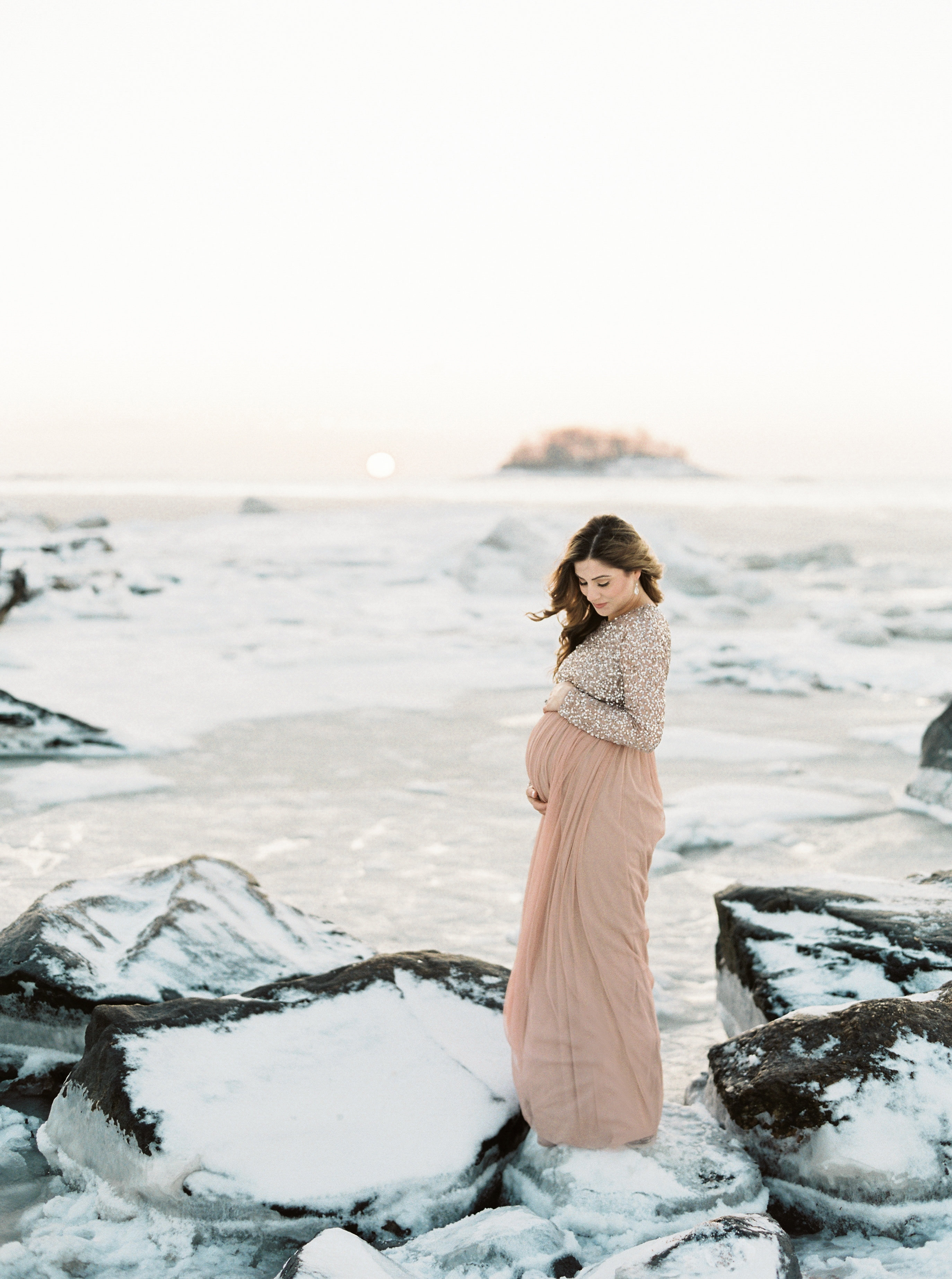 Life and style blogger Lauren McBride shares What to Wear for a Winter Maternity shoot, including tips on selecting clothing to layering for the session.