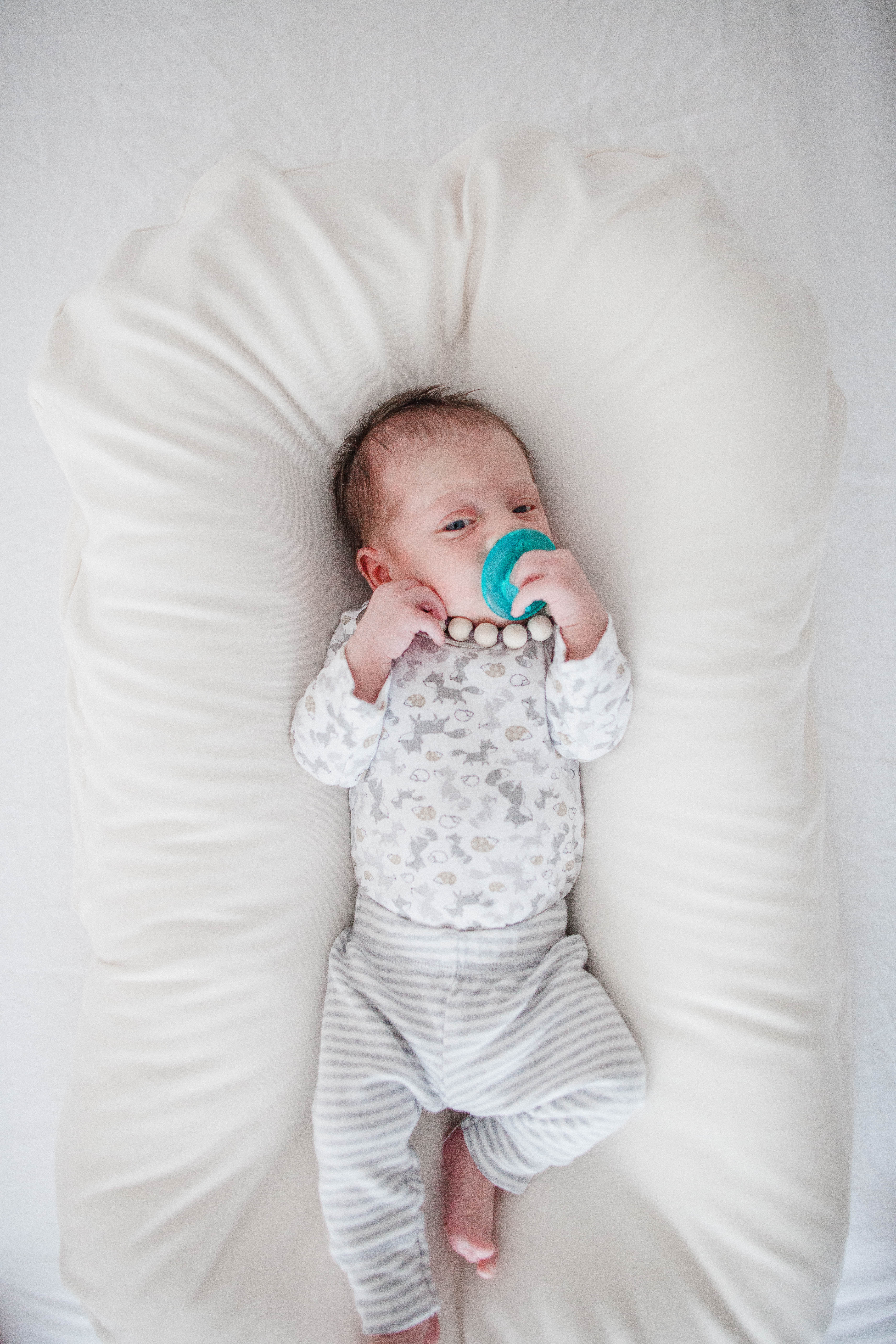 Life and style blogger Lauren McBride shares her Snuggle Me Review and coupon code and why it's the safest baby lounger on the market.