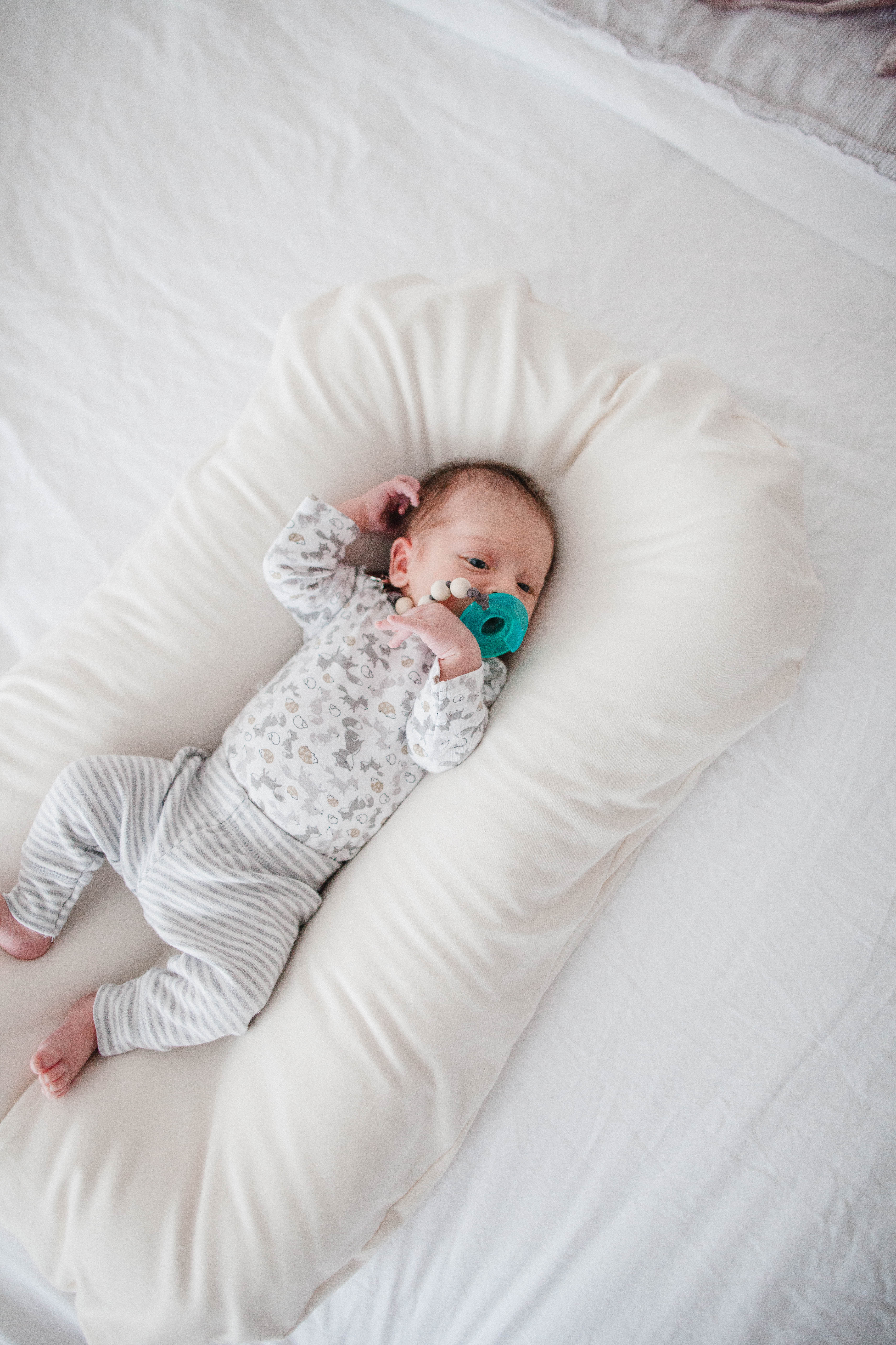 Life and style blogger Lauren McBride shares her Snuggle Me Review and coupon code and why it's the safest baby lounger on the market.