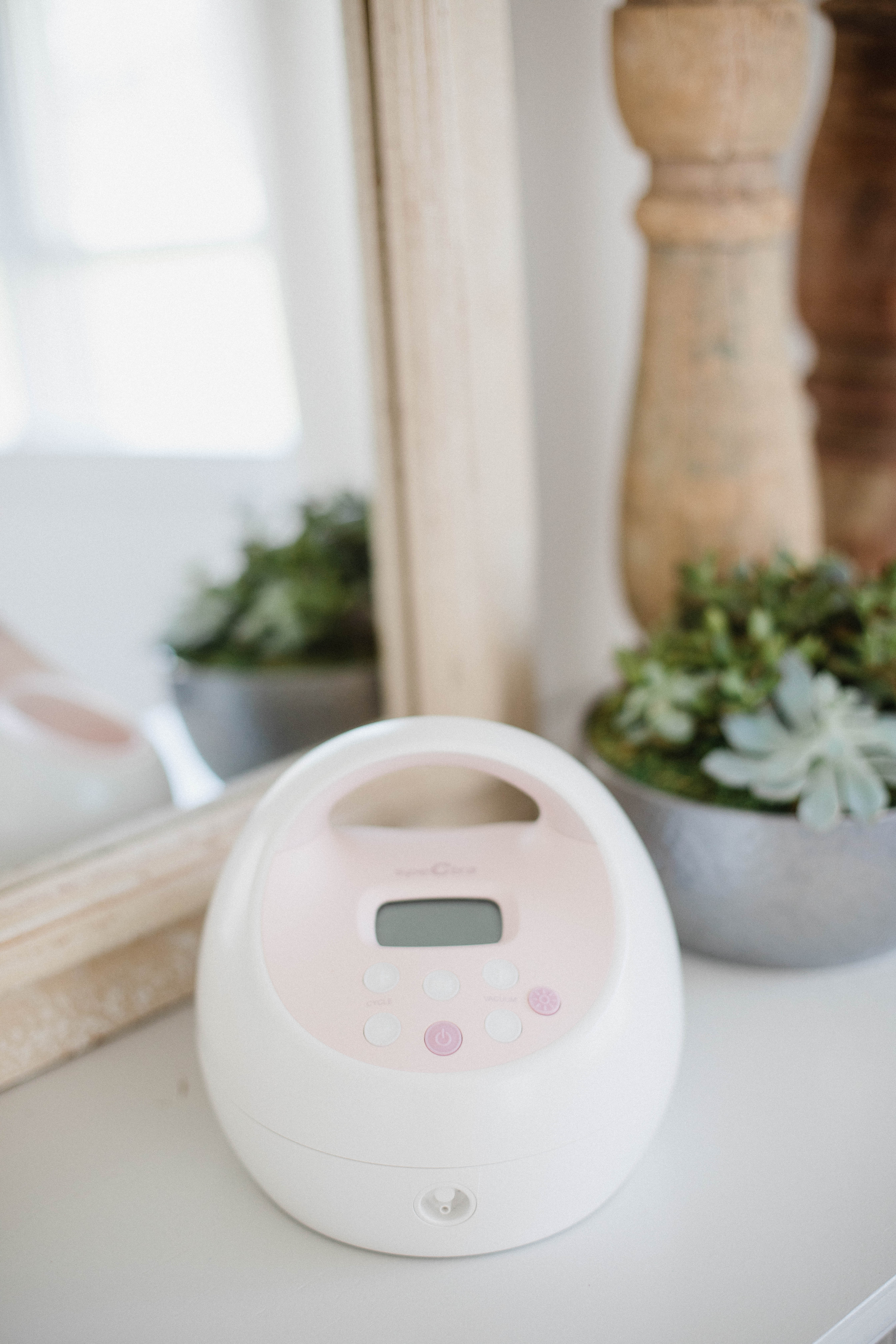 Life and style blogger Lauren McBride shares a Medela Pump in Style Advanced and Spectra S2 Comparison that explains the pros and cons of both breast pumps.