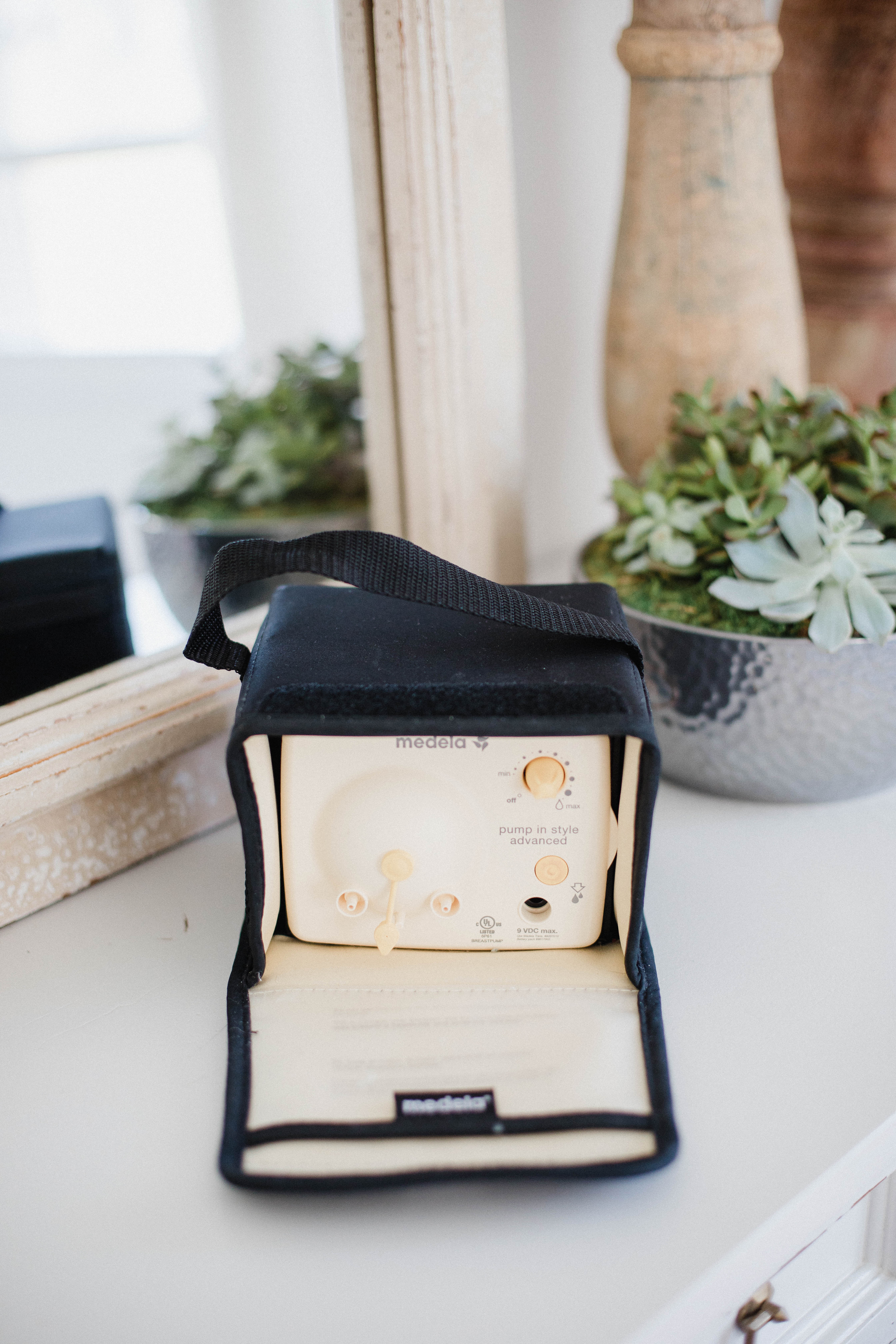 Life and style blogger Lauren McBride shares a Medela Pump in Style Advanced and Spectra S2 Comparison that explains the pros and cons of both breast pumps.