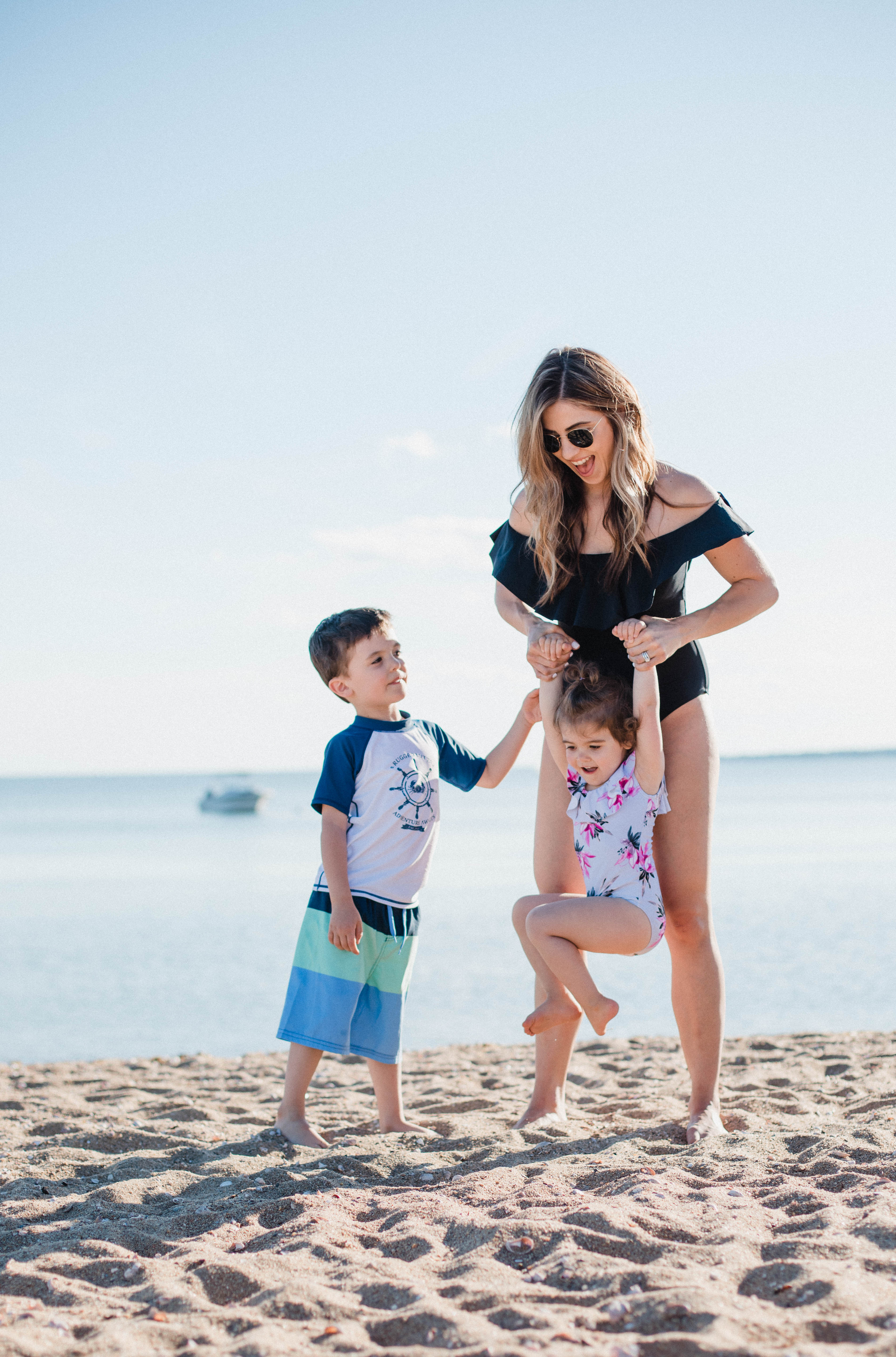 Life and style blogger Lauren McBride shares her Beach Essentials for Kids that will get your family through beach season this summer, featuring swimwear, toys, and more.