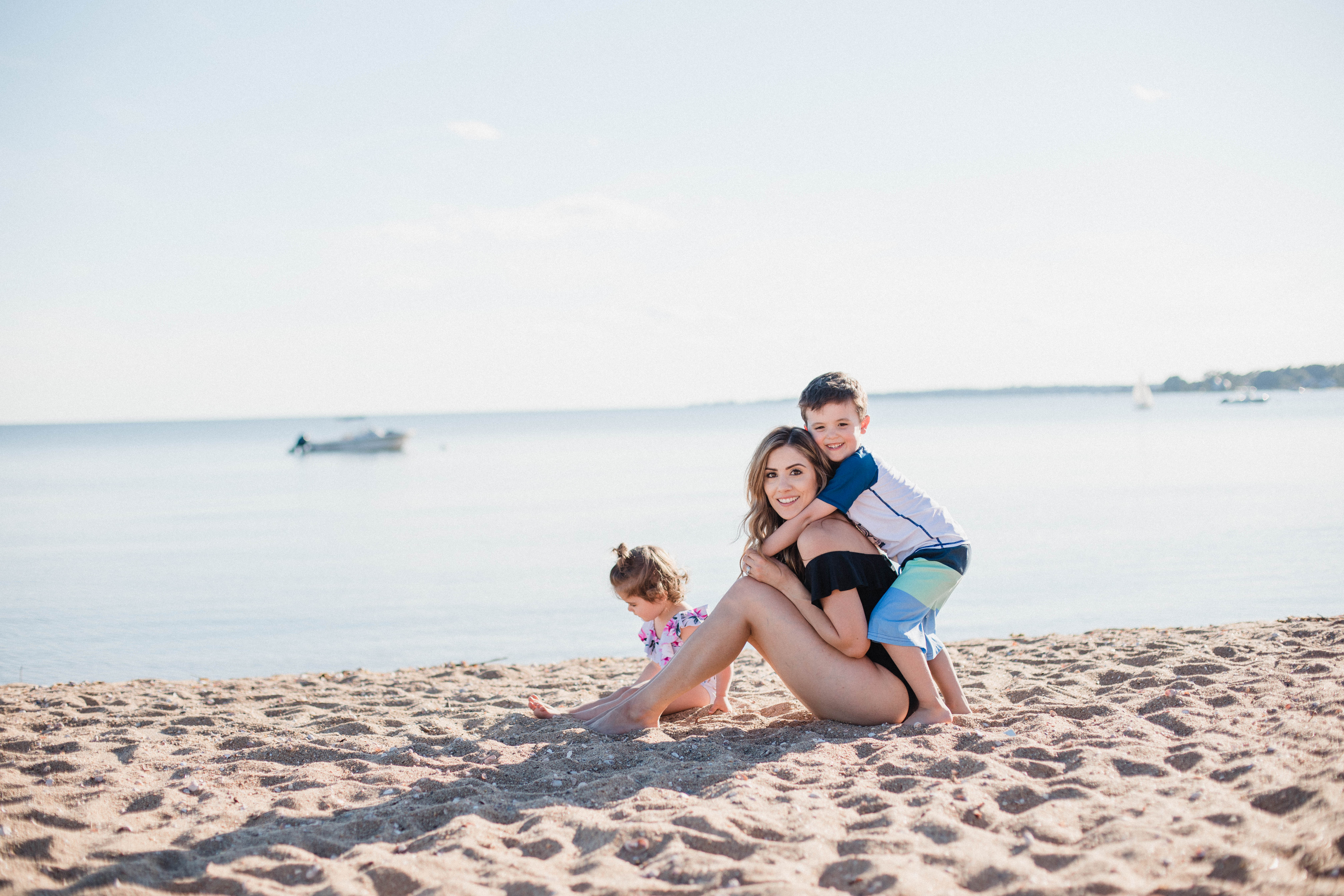 Life and style blogger Lauren McBride shares her Beach Essentials for Kids that will get your family through beach season this summer, featuring swimwear, toys, and more.