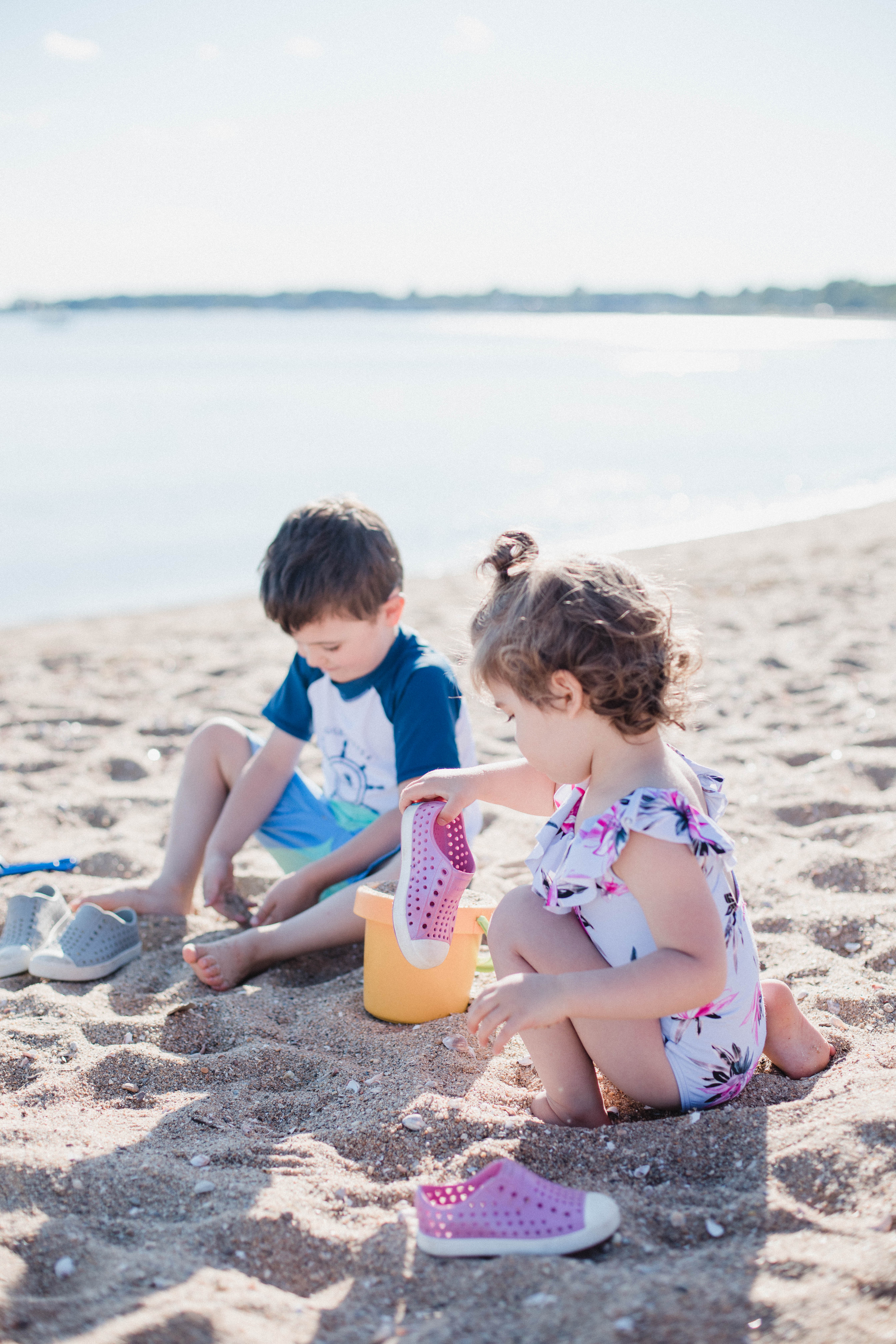 Life and style blogger Lauren McBride shares her Beach Essentials for Kids that will get your family through beach season this summer, featuring swimwear, toys, and more.