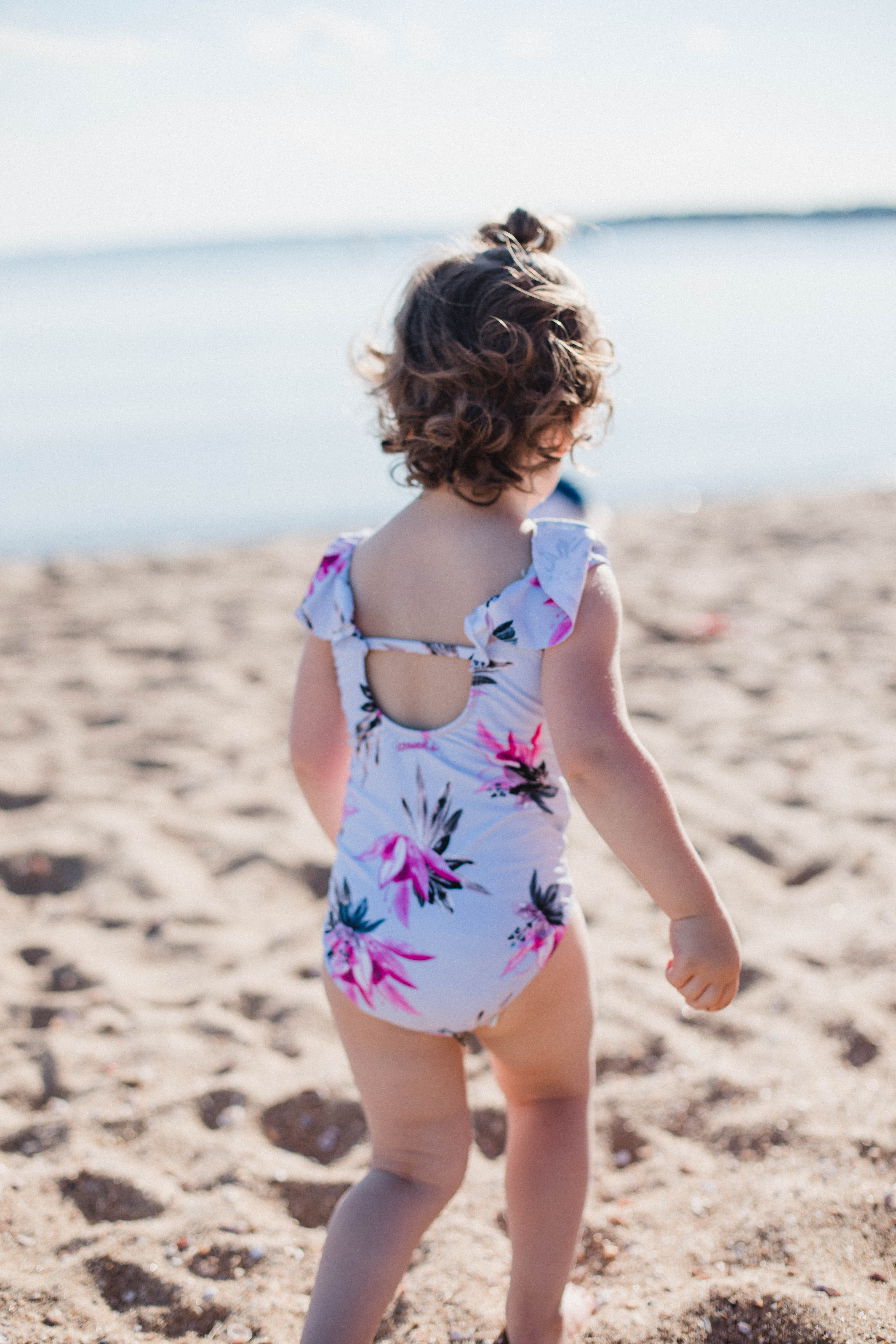 Life and style blogger Lauren McBride shares her Beach Essentials for Kids that will get your family through beach season this summer, featuring swimwear, toys, and more.
