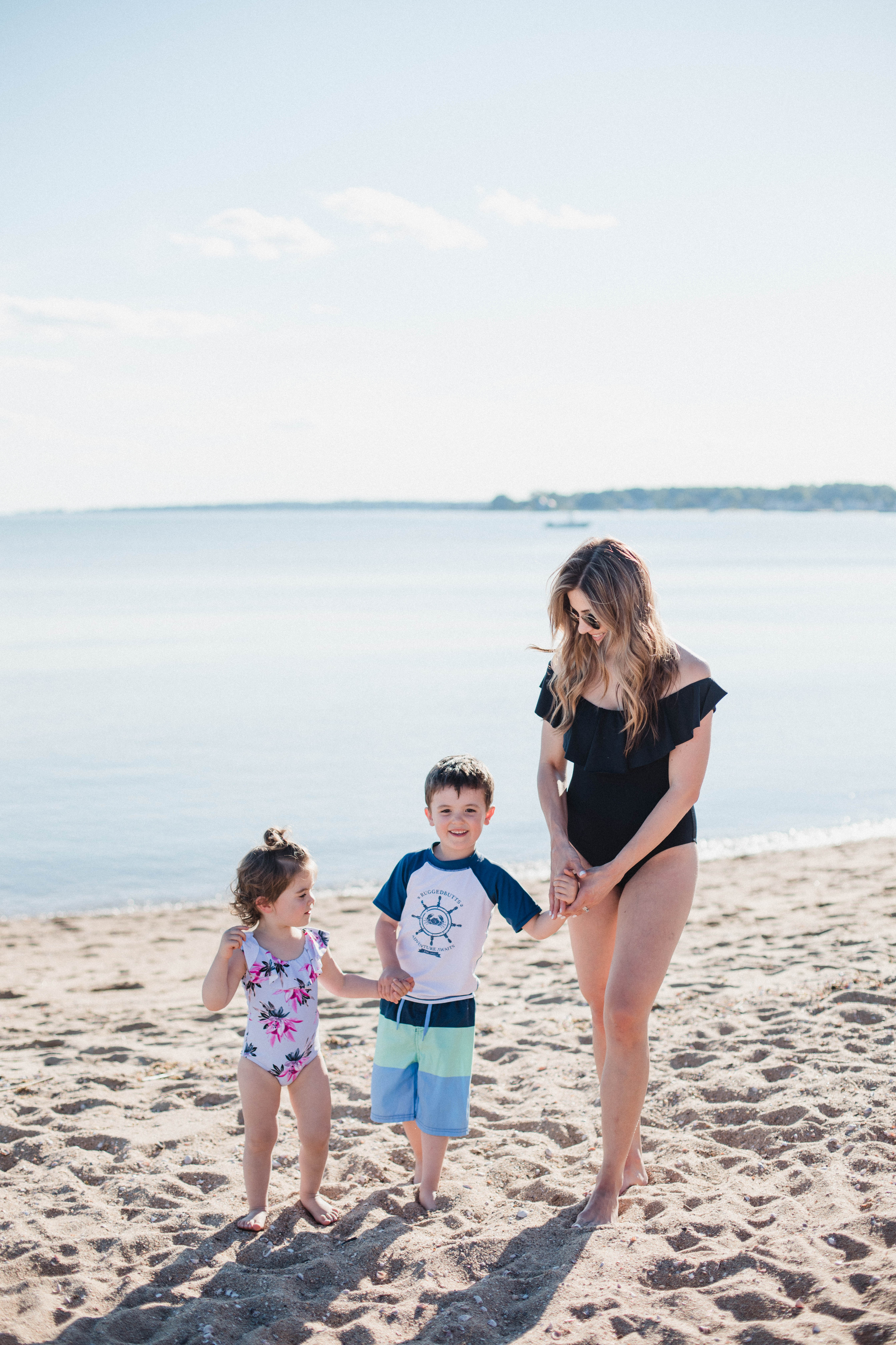 Life and style blogger Lauren McBride shares her Beach Essentials for Kids that will get your family through beach season this summer, featuring swimwear, toys, and more.