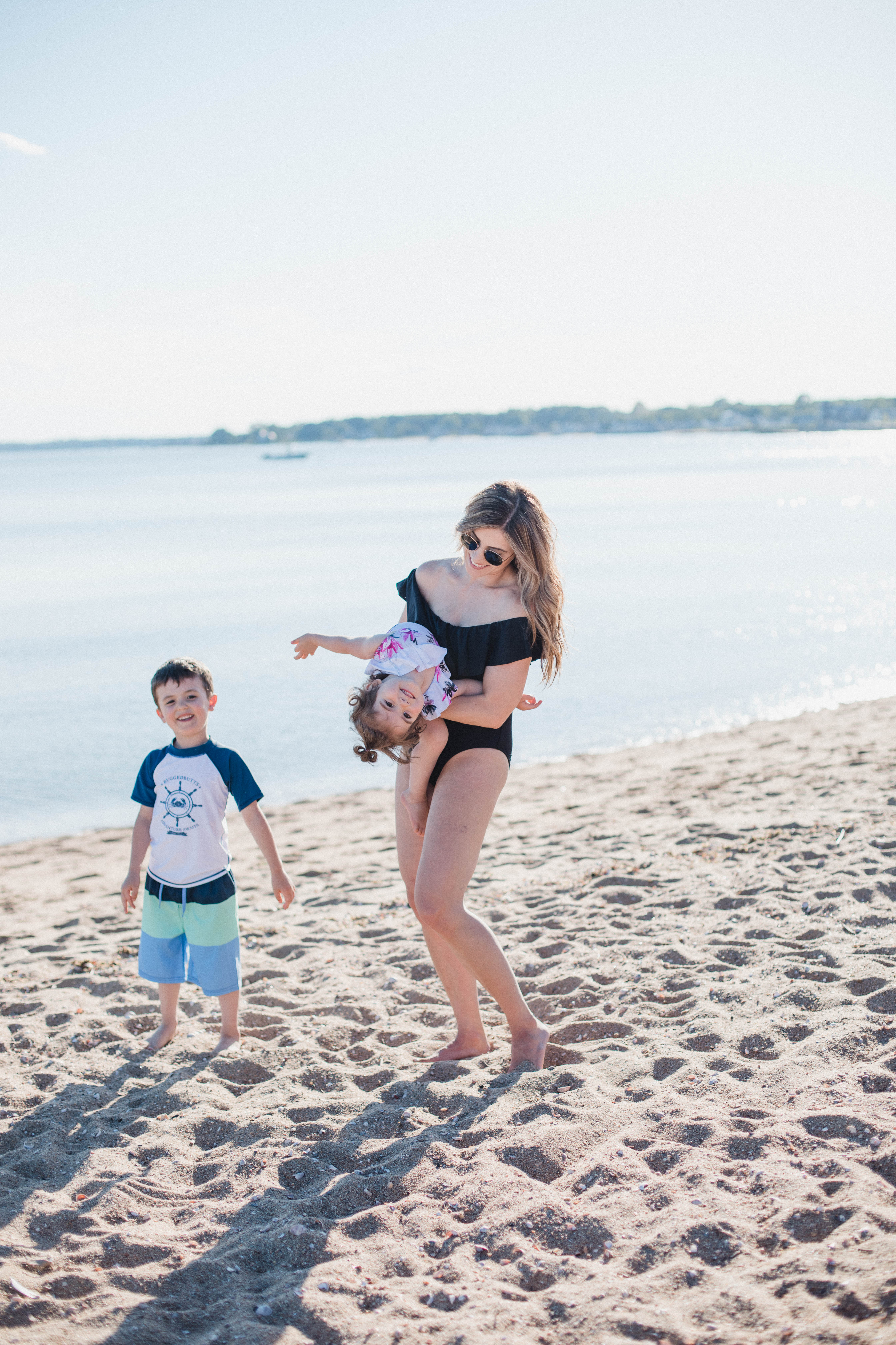 Life and style blogger Lauren McBride shares her Beach Essentials for Kids that will get your family through beach season this summer, featuring swimwear, toys, and more.