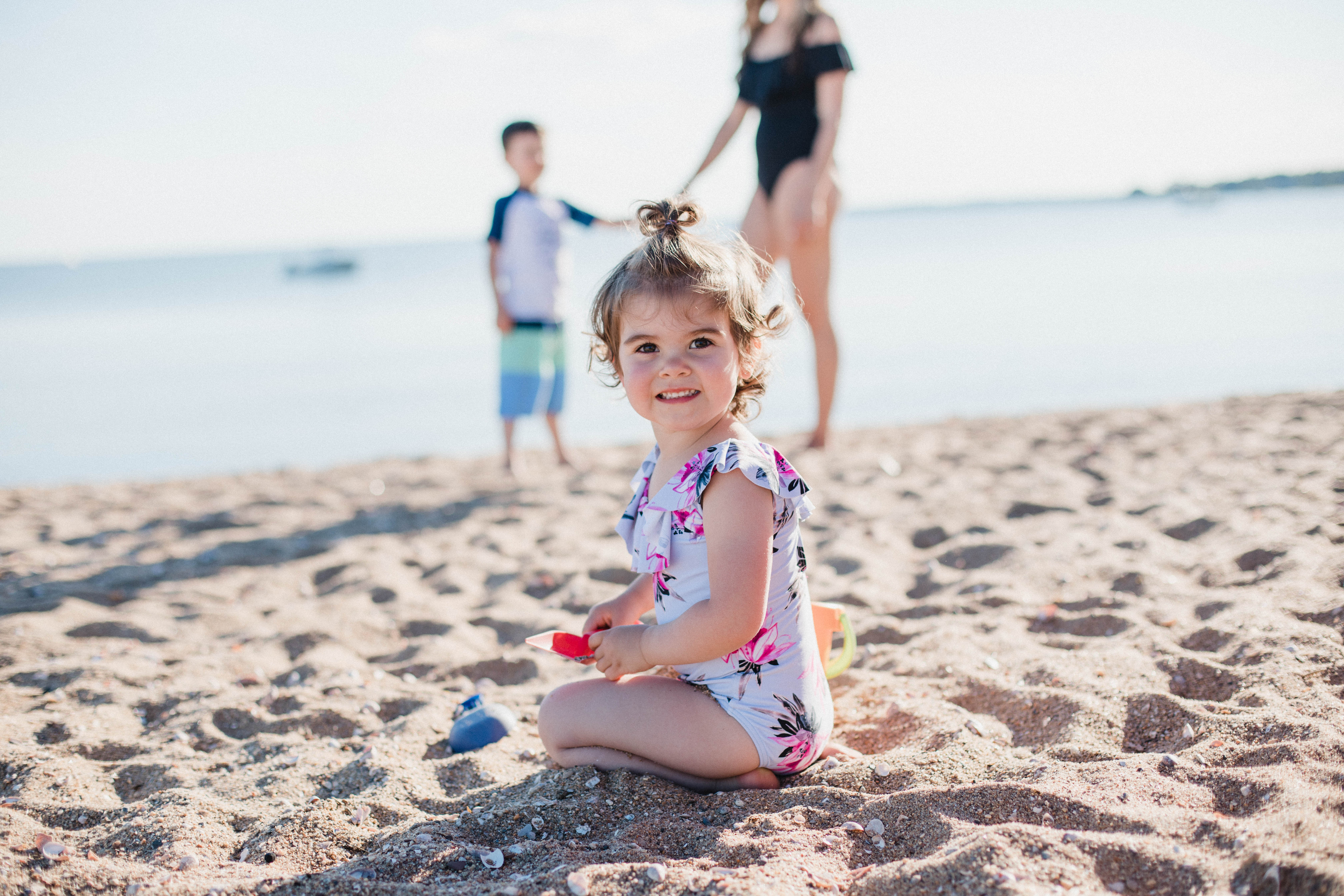 Life and style blogger Lauren McBride shares her Beach Essentials for Kids that will get your family through beach season this summer, featuring swimwear, toys, and more.