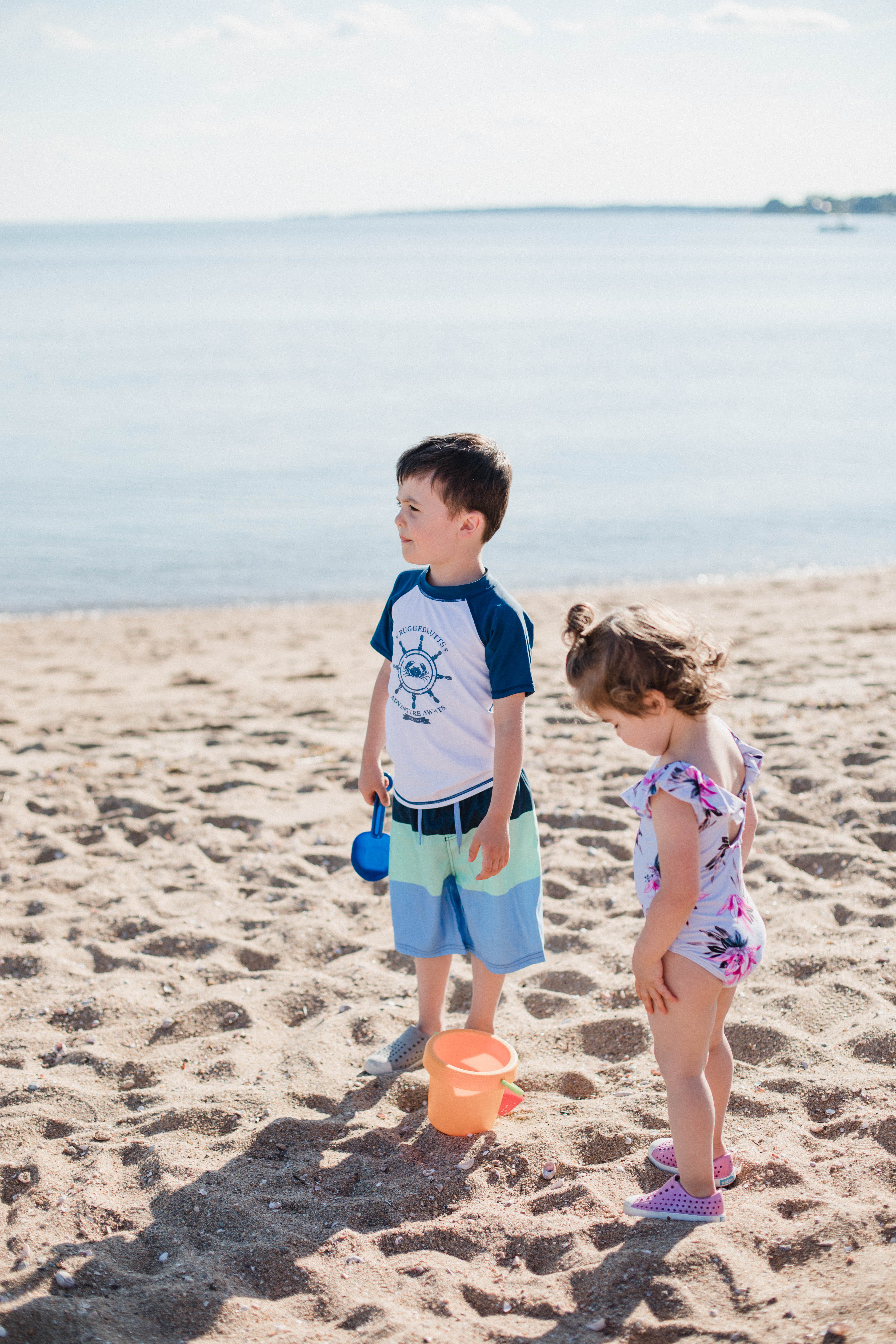 Life and style blogger Lauren McBride shares her Beach Essentials for Kids that will get your family through beach season this summer, featuring swimwear, toys, and more.