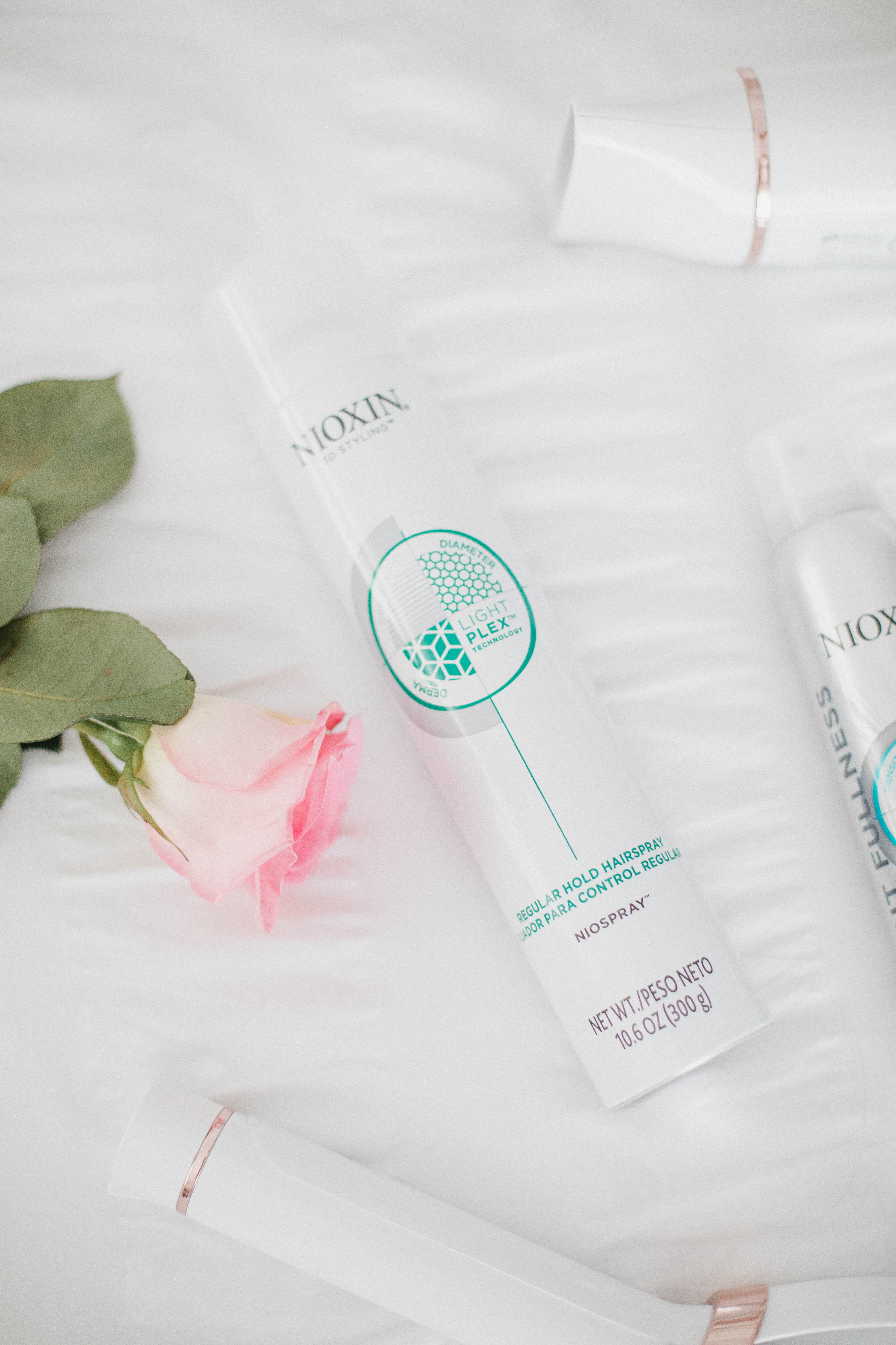 Life and style blogger Lauren McBride shares the Best Styling Products for Postpartum Hair loss featuring products from Nioxin.