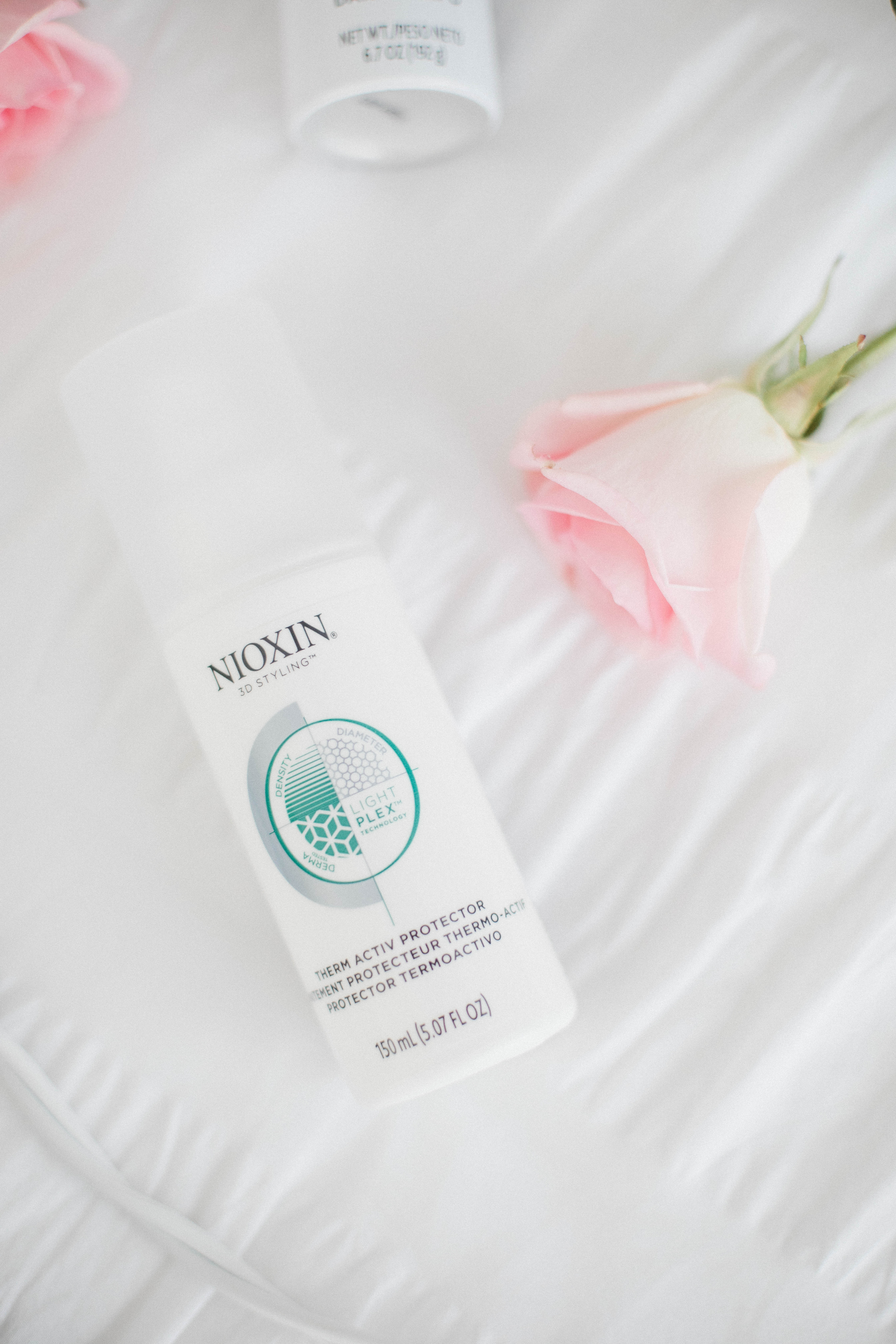 Life and style blogger Lauren McBride shares the Best Styling Products for Postpartum Hair loss featuring products from Nioxin.