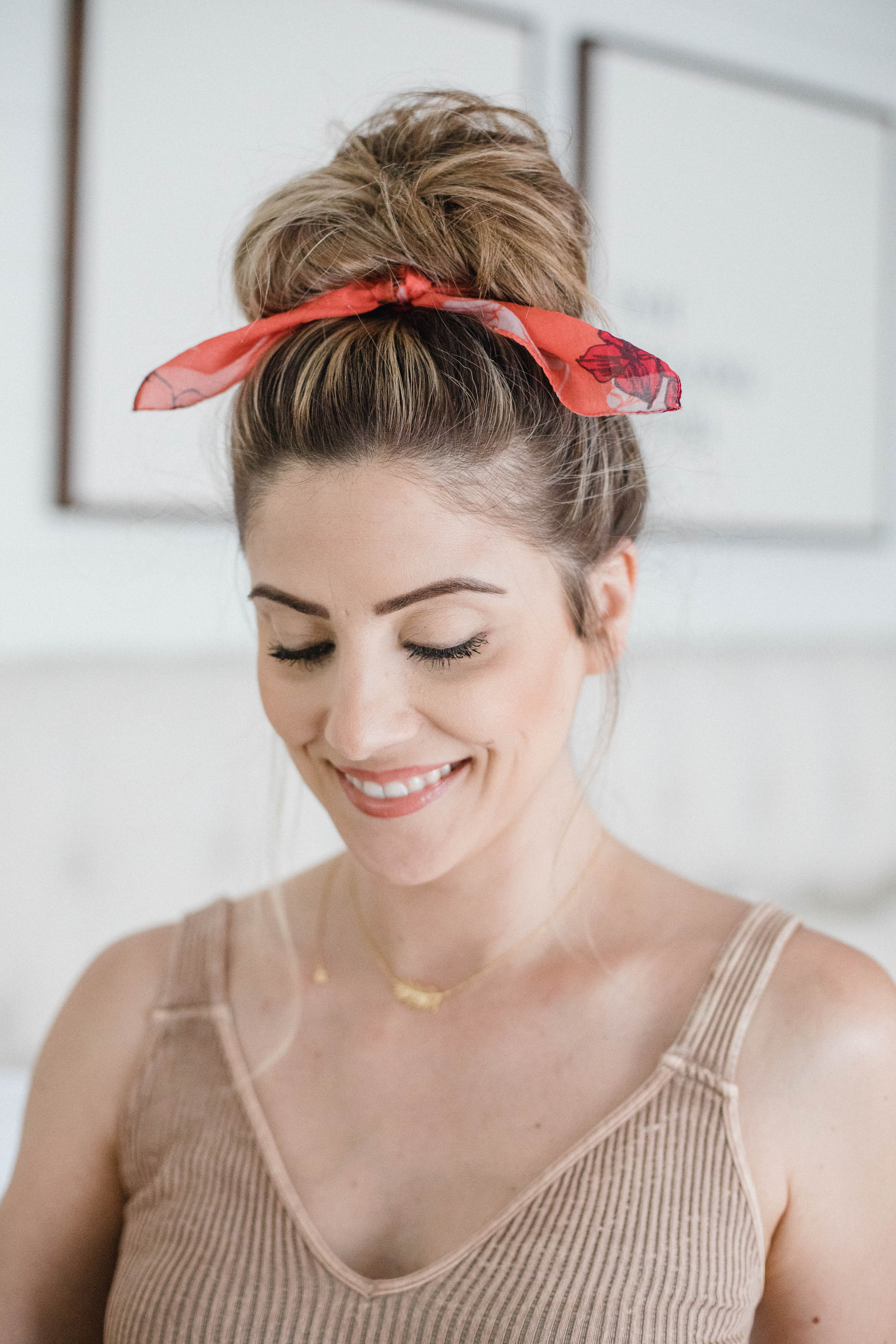 Life and style blogger Lauren McBride shares a Simple Top Knot Tutorial featuring styling products from Nioxin to help with postpartum hair loss.