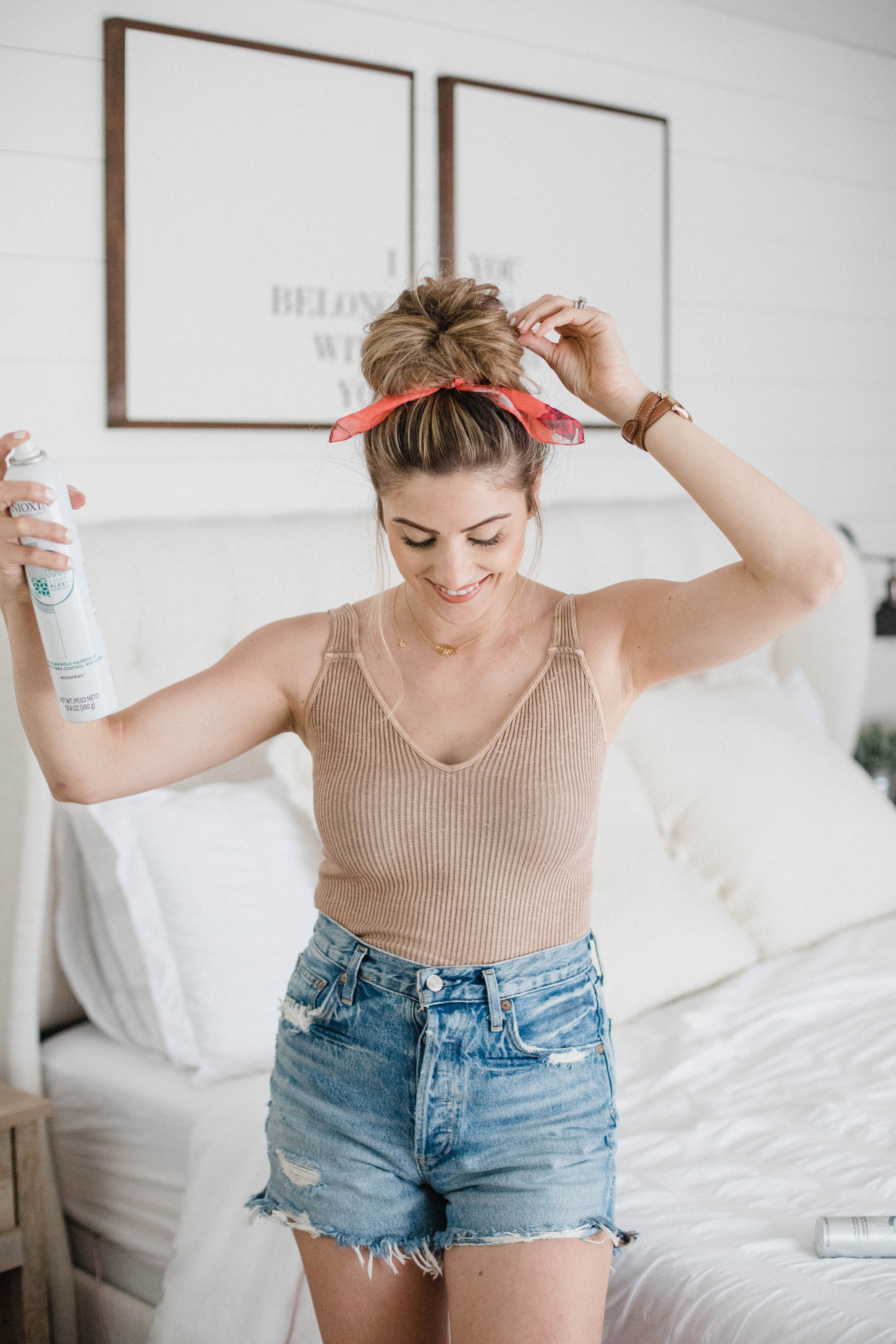 Life and style blogger Lauren McBride shares a Simple Top Knot Tutorial featuring styling products from Nioxin to help with postpartum hair loss.