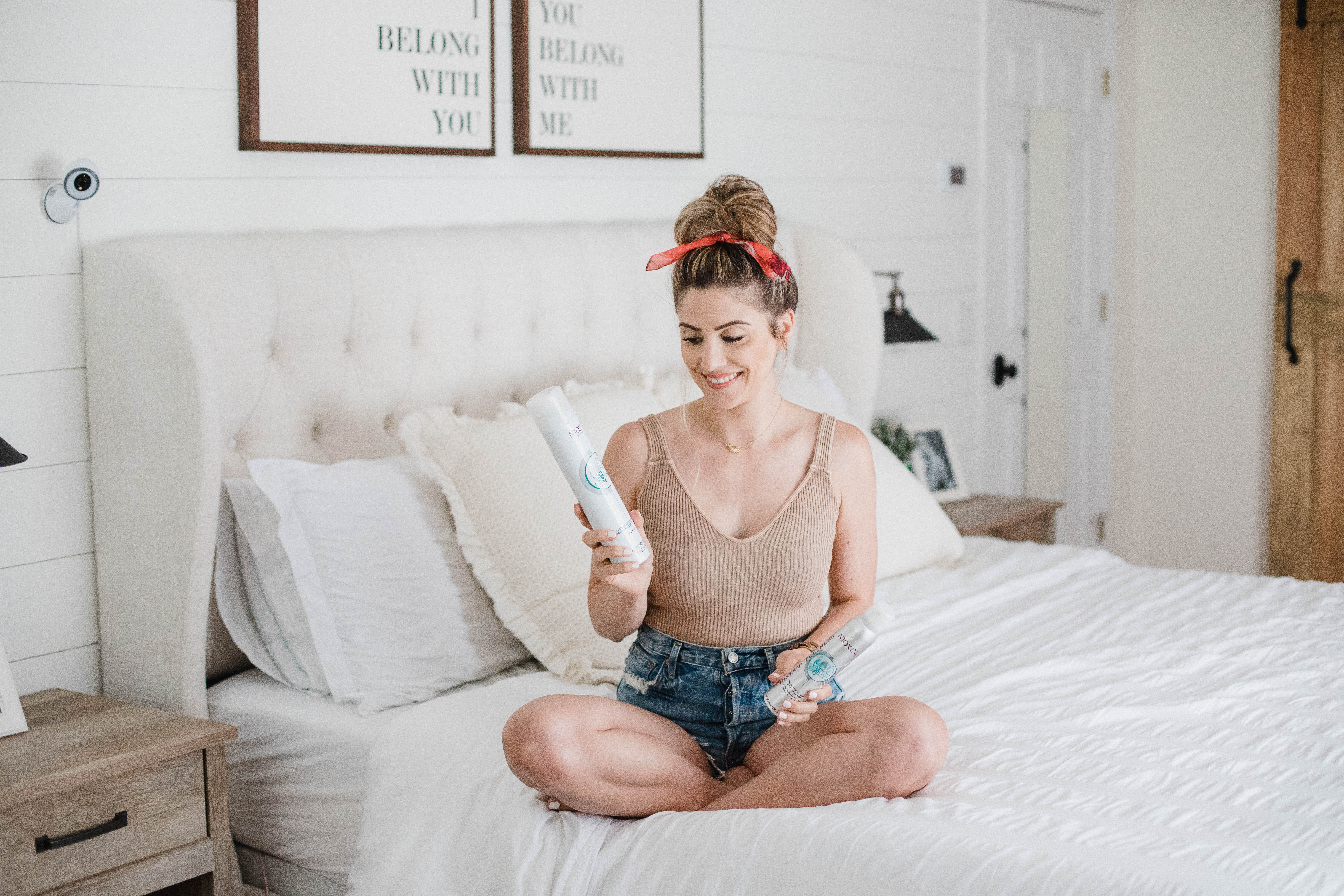 Life and style blogger Lauren McBride shares a Simple Top Knot Tutorial featuring styling products from Nioxin to help with postpartum hair loss.