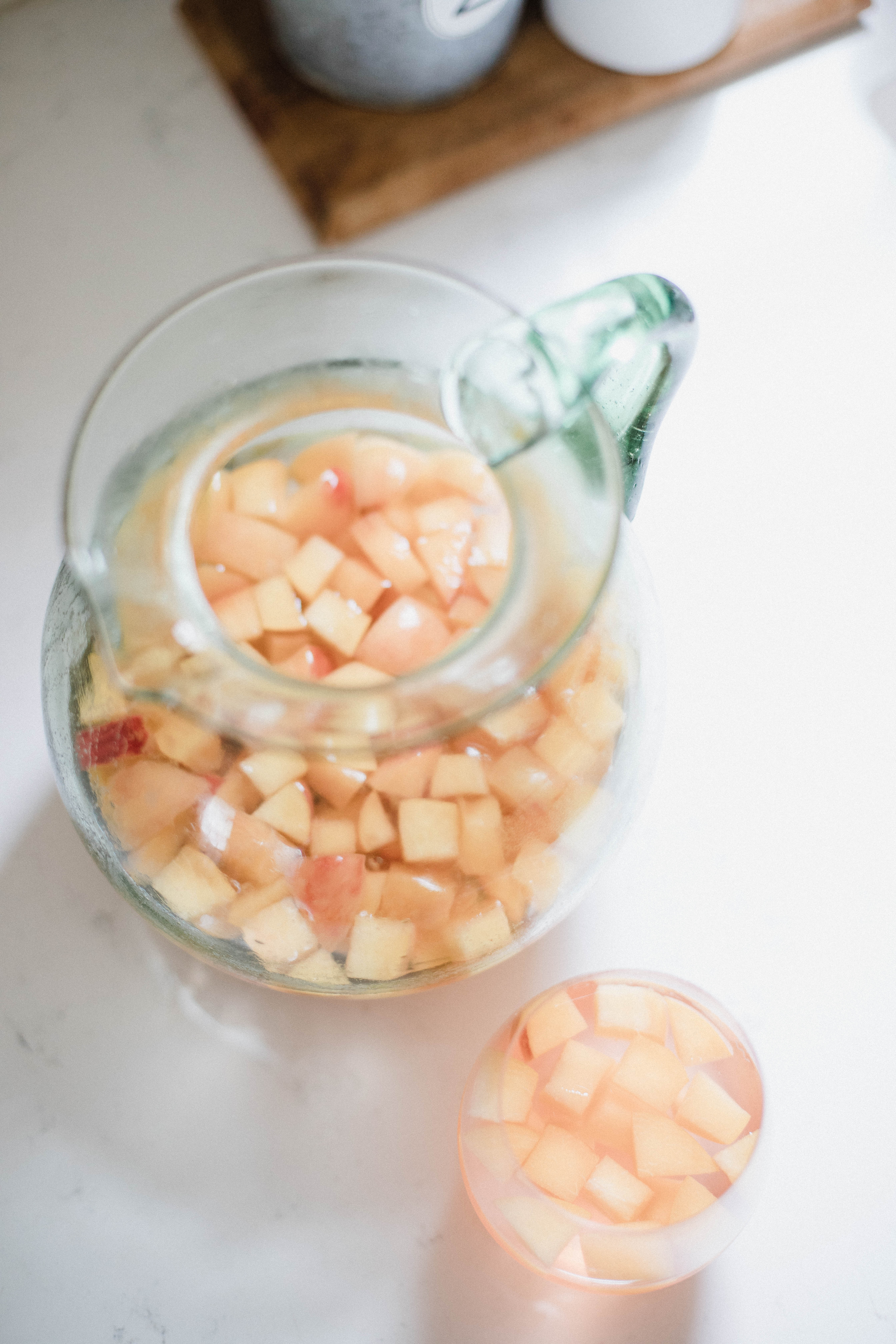 Life and style blogger Lauren McBride shares a simple Summer Peach Sangria that's deliciously refreshing and sweet for the season.