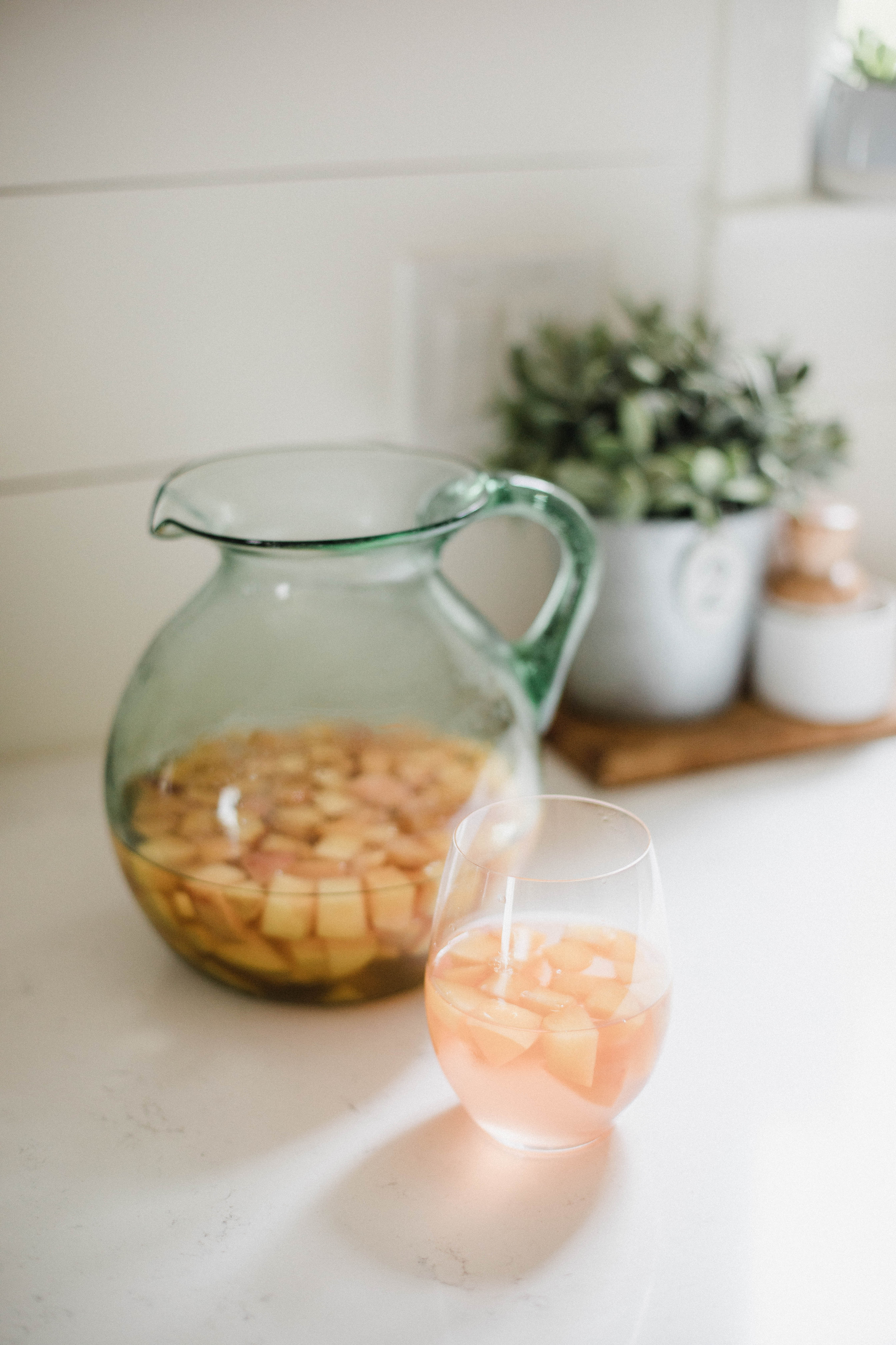 Life and style blogger Lauren McBride shares a simple Summer Peach Sangria that's deliciously refreshing and sweet for the season.