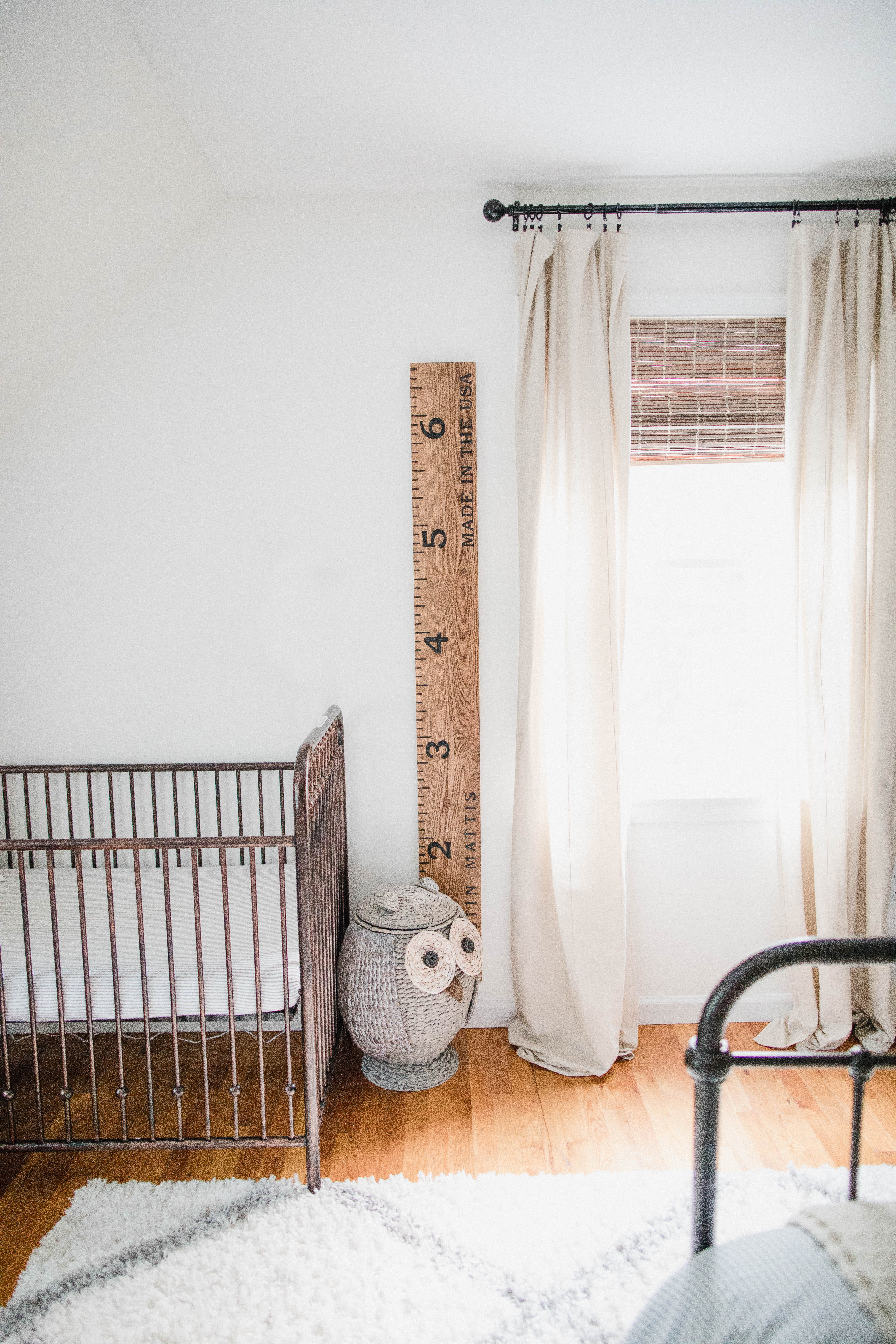 Connecticut life and style blogger Lauren McBride shares a shared boys bedroom update featuring a unique wallpaper wall using products from Home Depot.