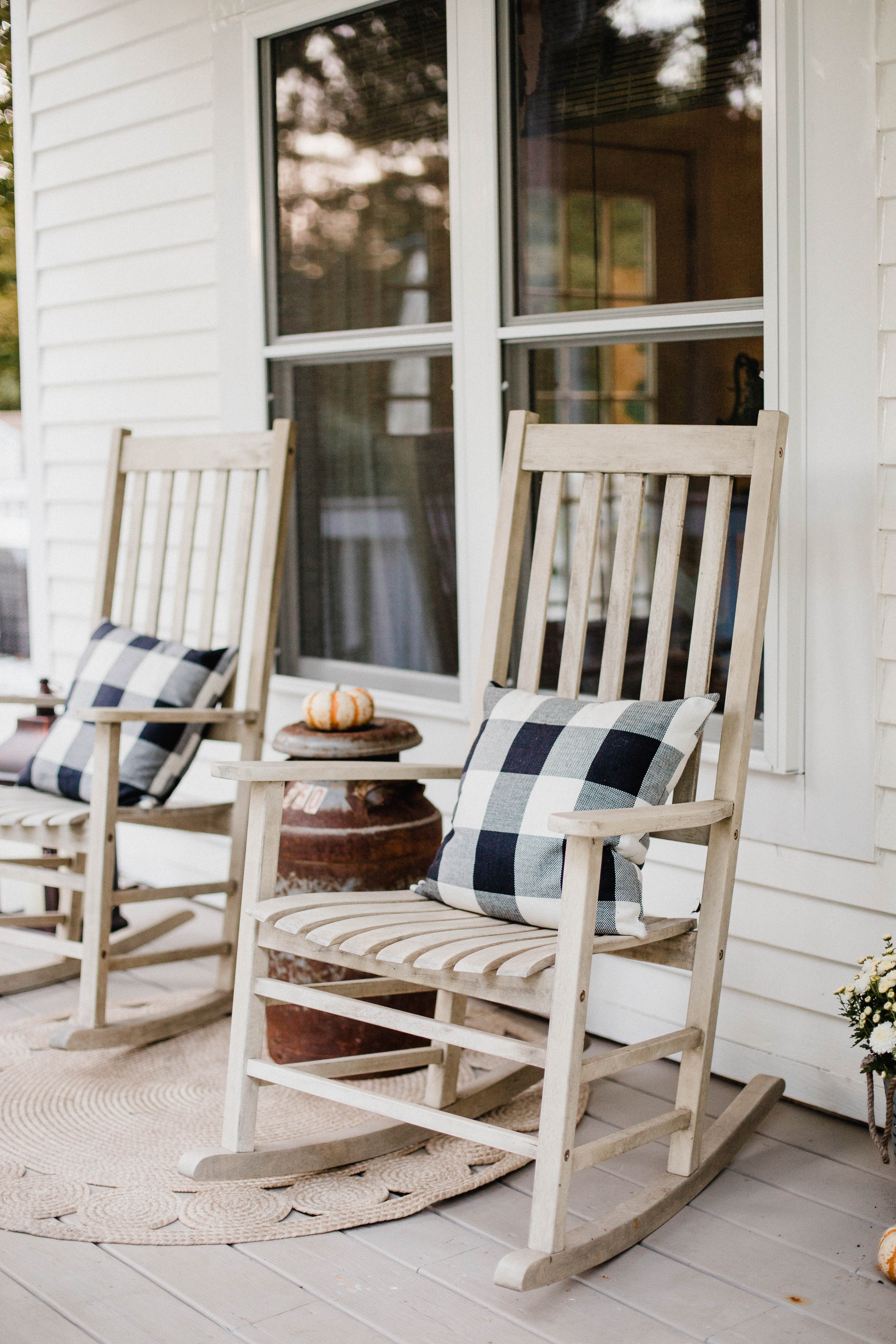 Life and style blogger Lauren McBride shares her Fall Front Porch featuring a mix of natural and vintage elements as well as outdoor lanterns with flameless candles. 