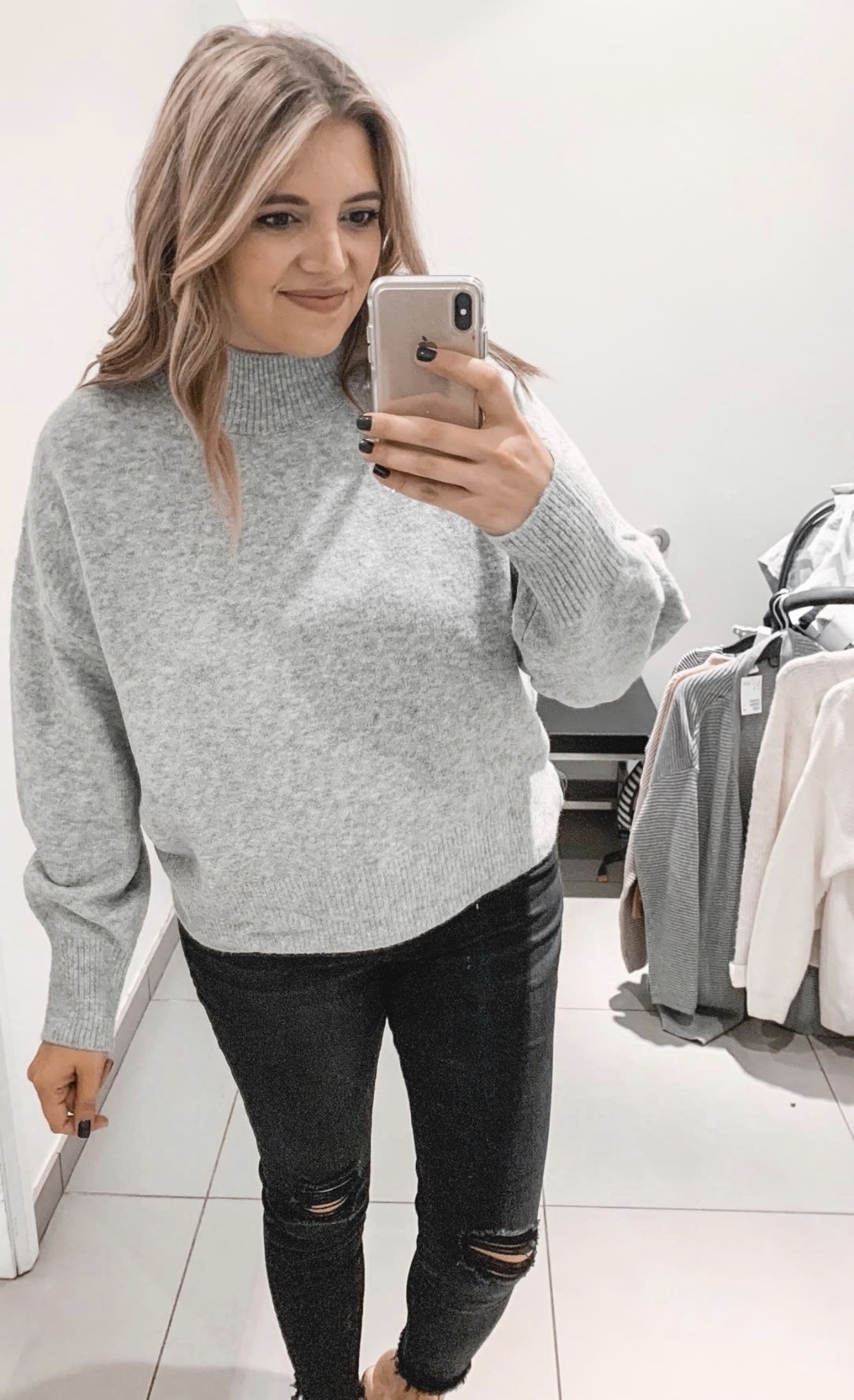 Connecticut life and style blogger Lauren McBride shares a Fall H&M try on session featuring cozy sweaters and scarves for under $35.
