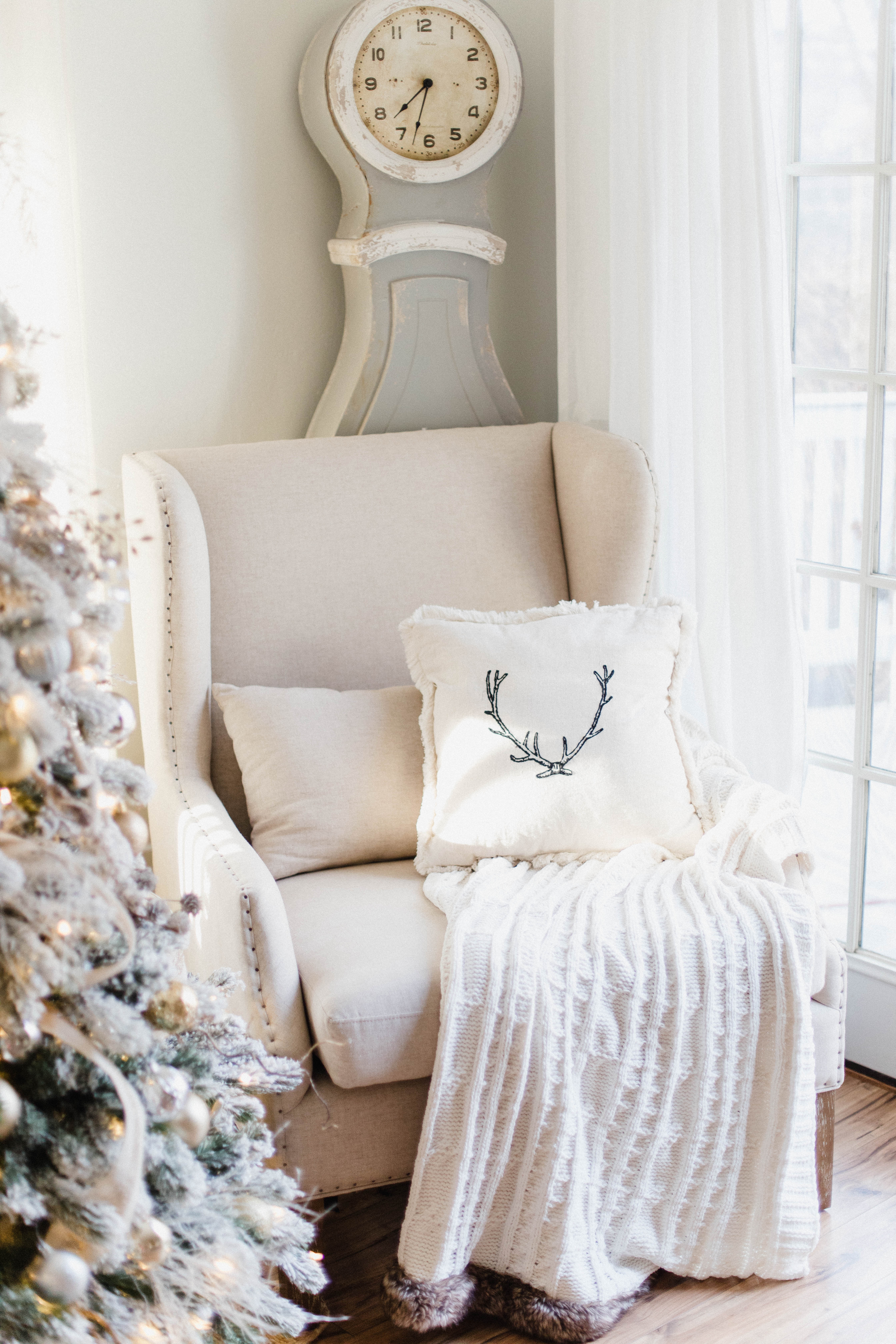 Connecticut life and style blogger Lauren McBride shares her Christmas Cottage Living Room for the 2018 Christmas season.