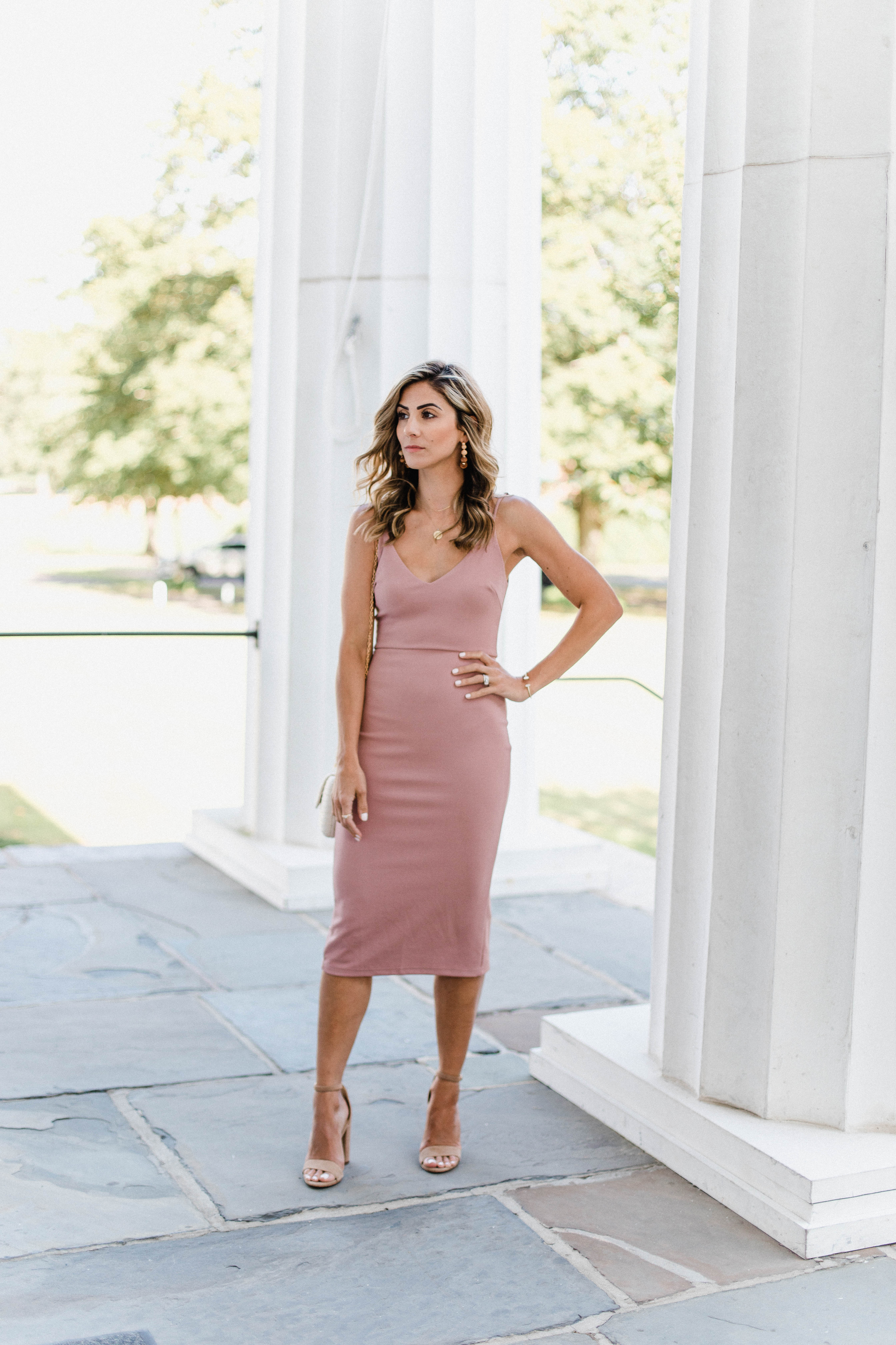 Connecticut life and style blogger Lauren McBride shares Summer Wedding Guest Dress options, as well as how to transition them to the fall season.