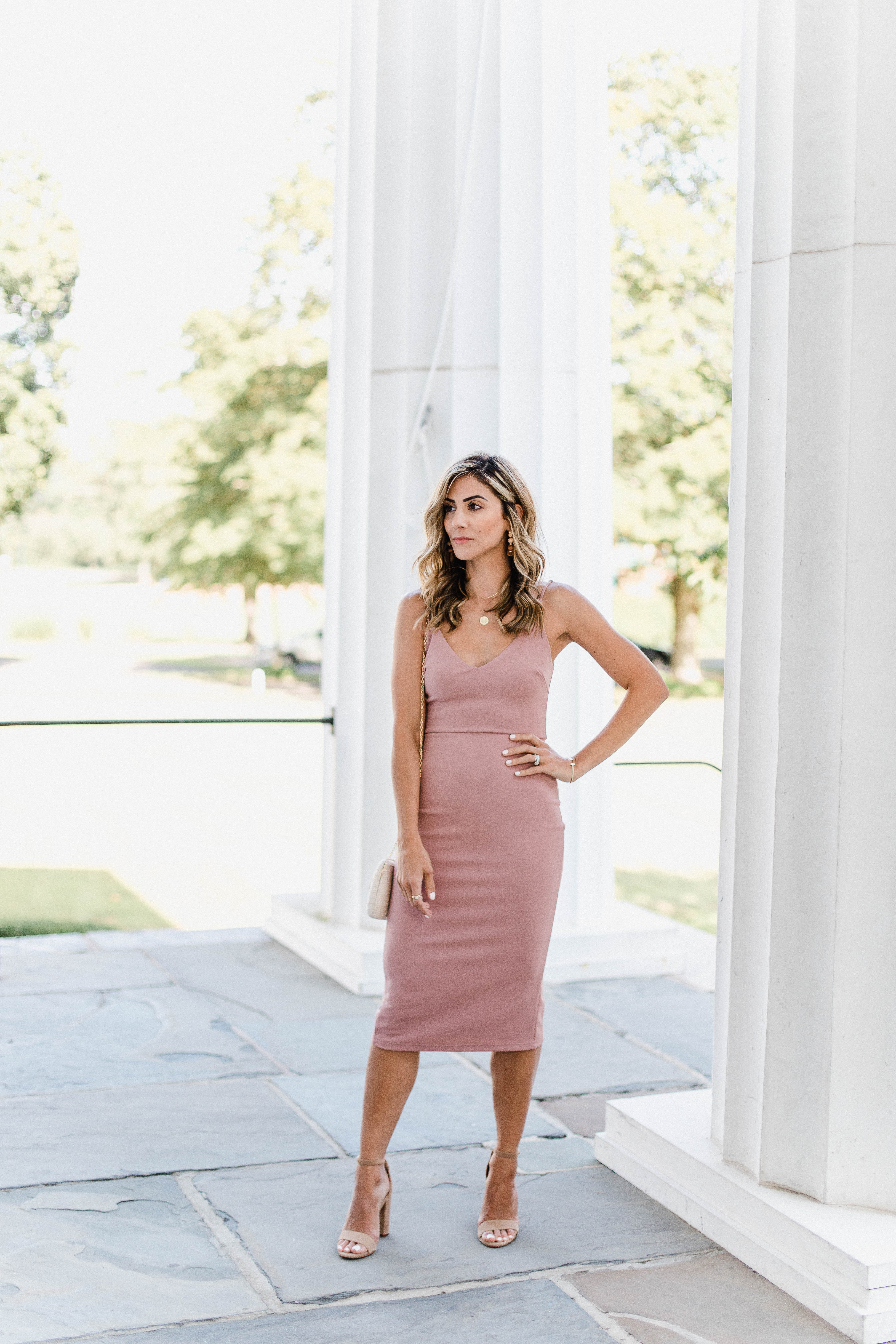 Connecticut life and style blogger Lauren McBride shares Summer Wedding Guest Dress options, as well as how to transition them to the fall season.