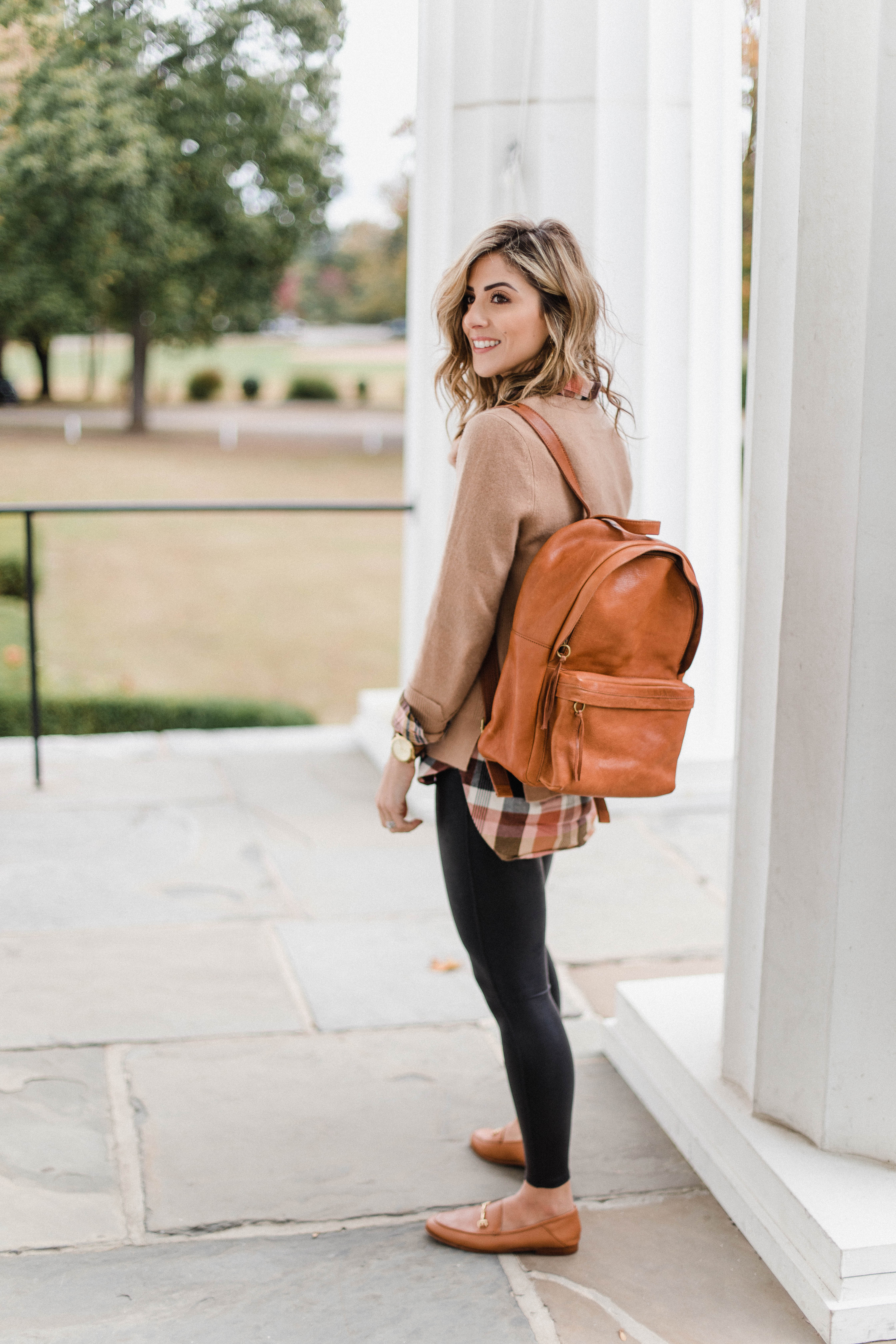 Connecticut life and style blogger Lauren McBride shares How to Style Spanx Leather Leggings, including sizing and style tips and inspirational outfits. 