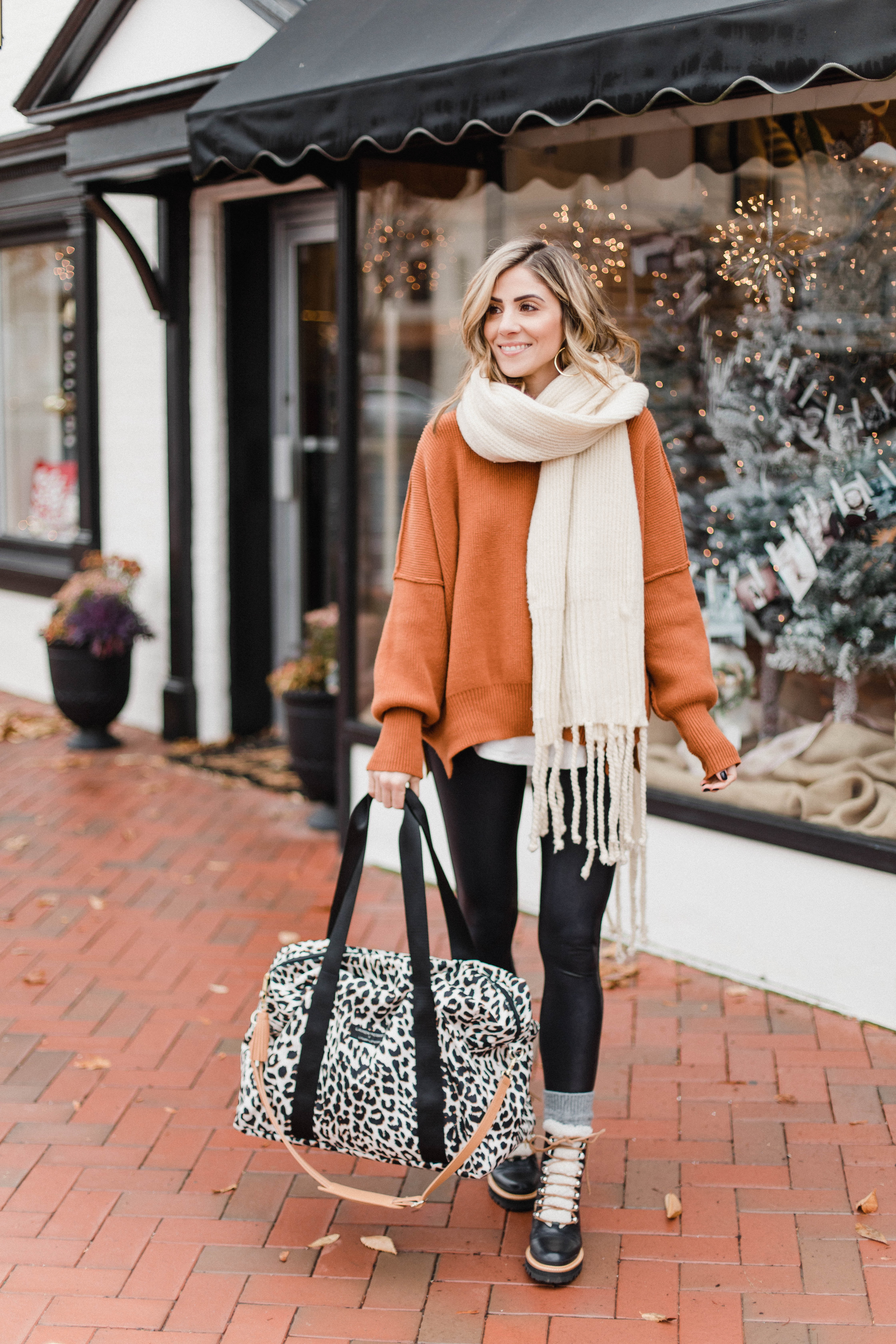 Connecticut life and style blogger Lauren McBride shares her Lauren McBride x Logan and Lenora collection launch, featuring a leopard print waterproof and stain resistant travel bag.