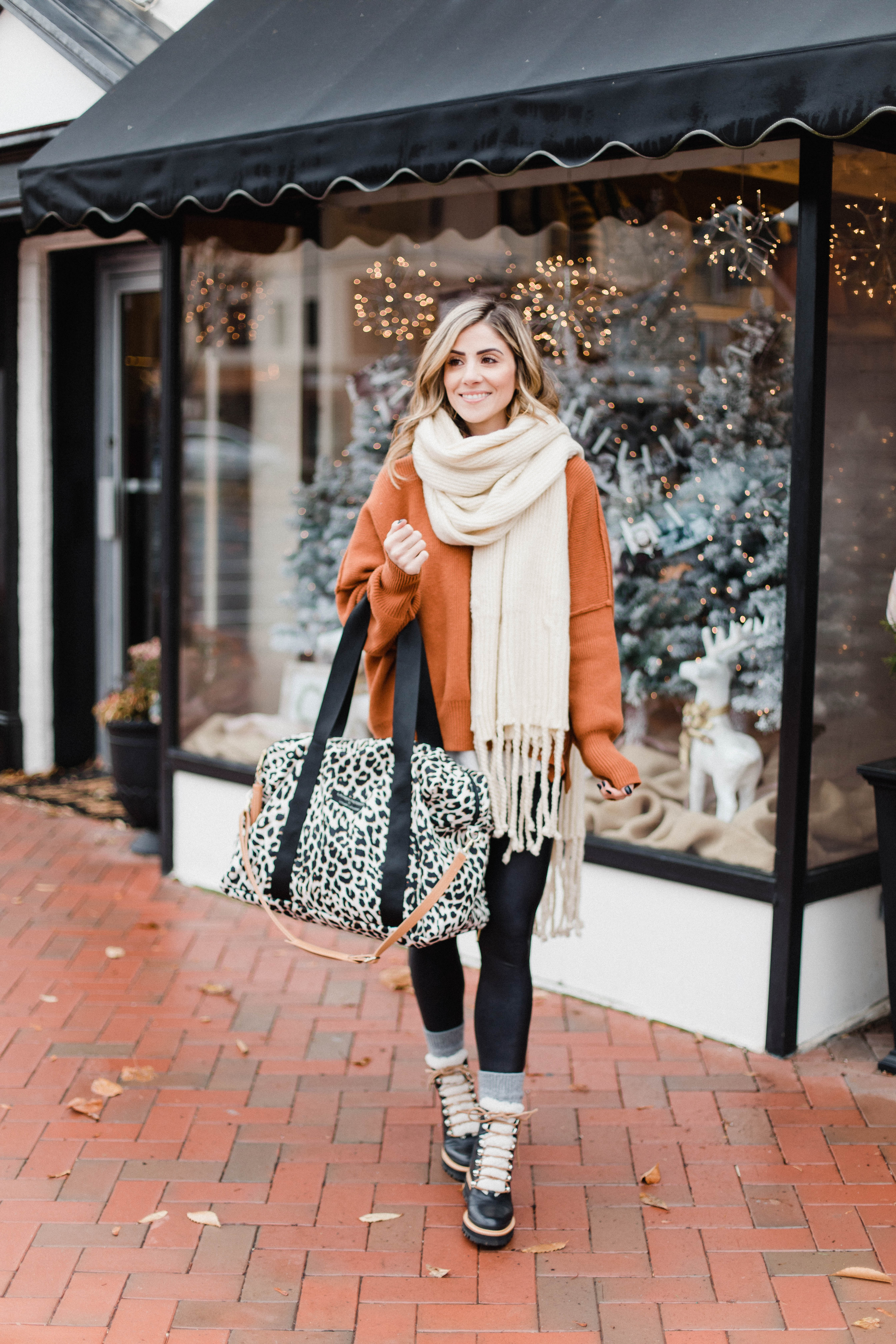 Connecticut life and style blogger Lauren McBride shares her Lauren McBride x Logan and Lenora collection launch, featuring a leopard print waterproof and stain resistant travel bag.