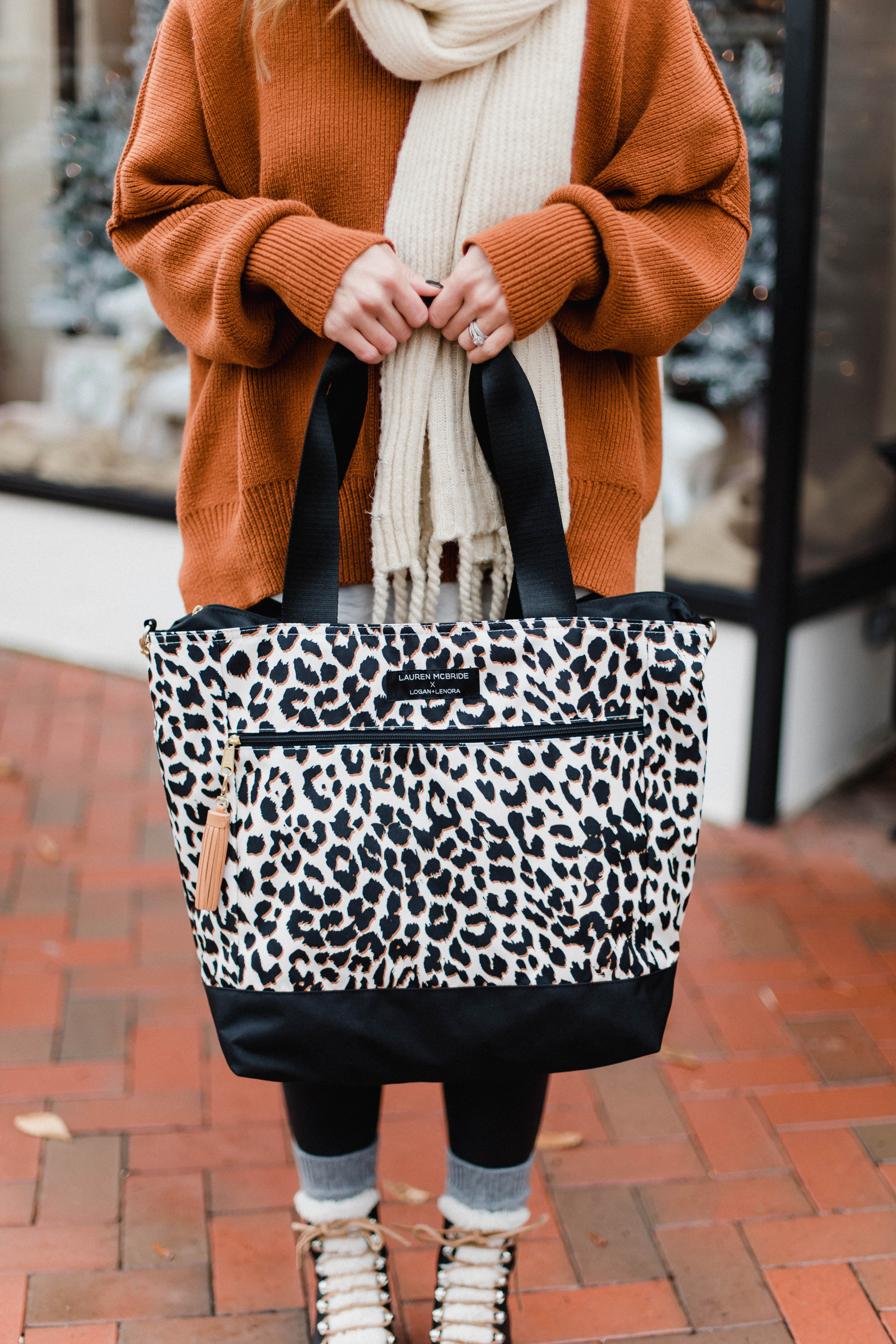 Connecticut life and style blogger Lauren McBride shares her Lauren McBride x Logan and Lenora collection launch, featuring a leopard print waterproof and stain resistant travel bag.