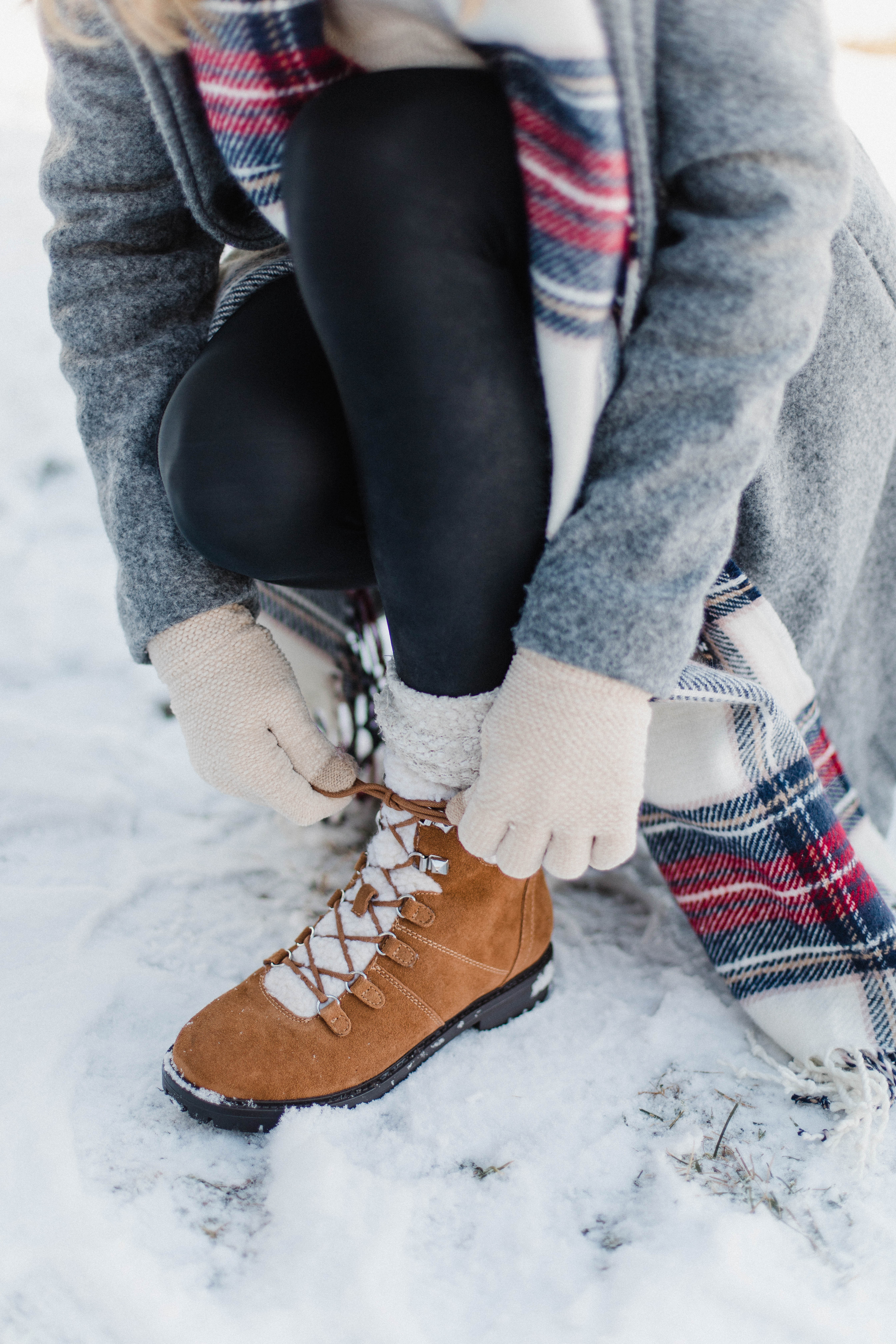 Connecticut life and style blogger Lauren McBride shares a pair of faux-fur shearling boots that are under $100 and perfect for the winter season.