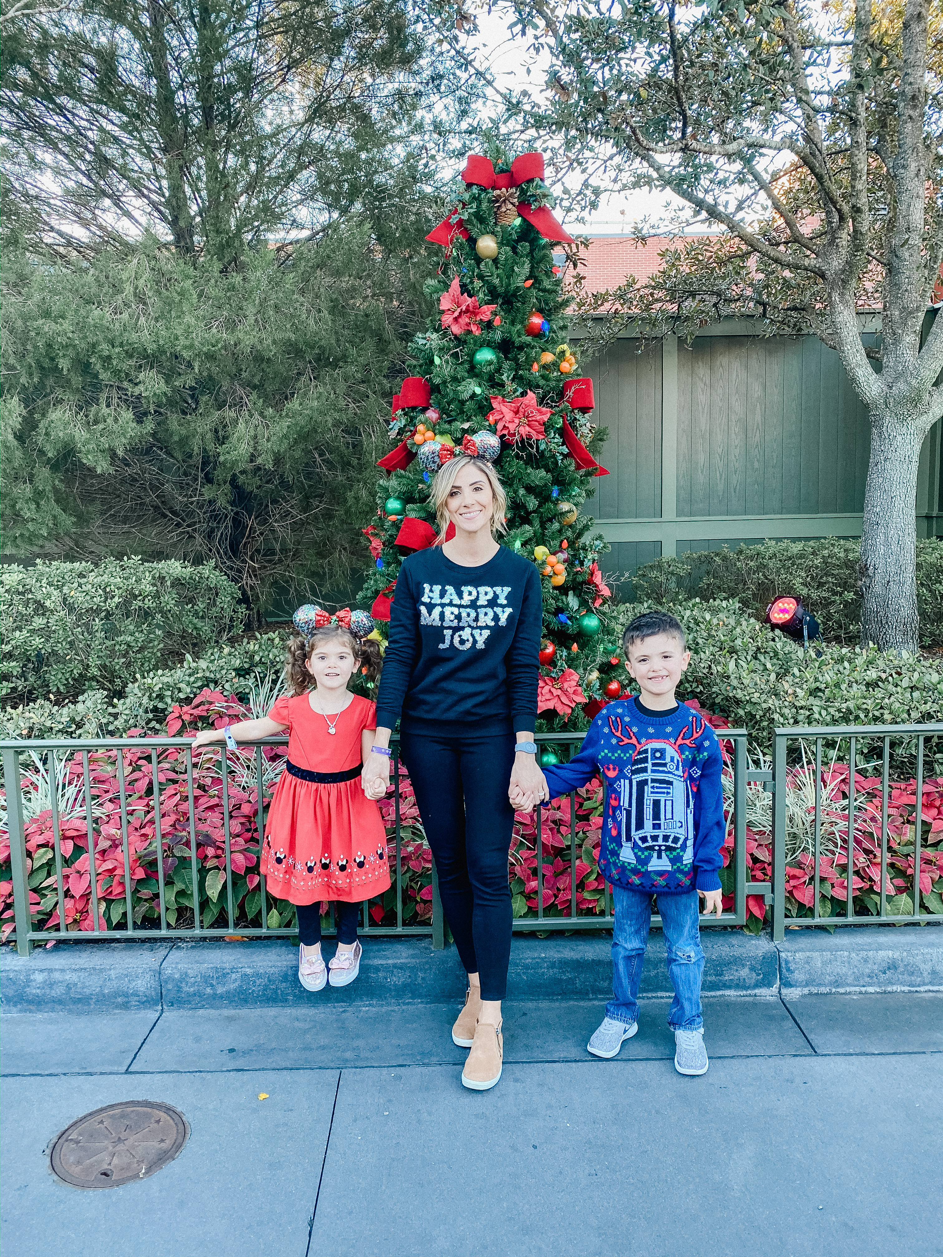 Connecticut life and style blogger Lauren McBride shares what to pack for Disney World in December, including a variety of simple and comfortable outfit ideas.