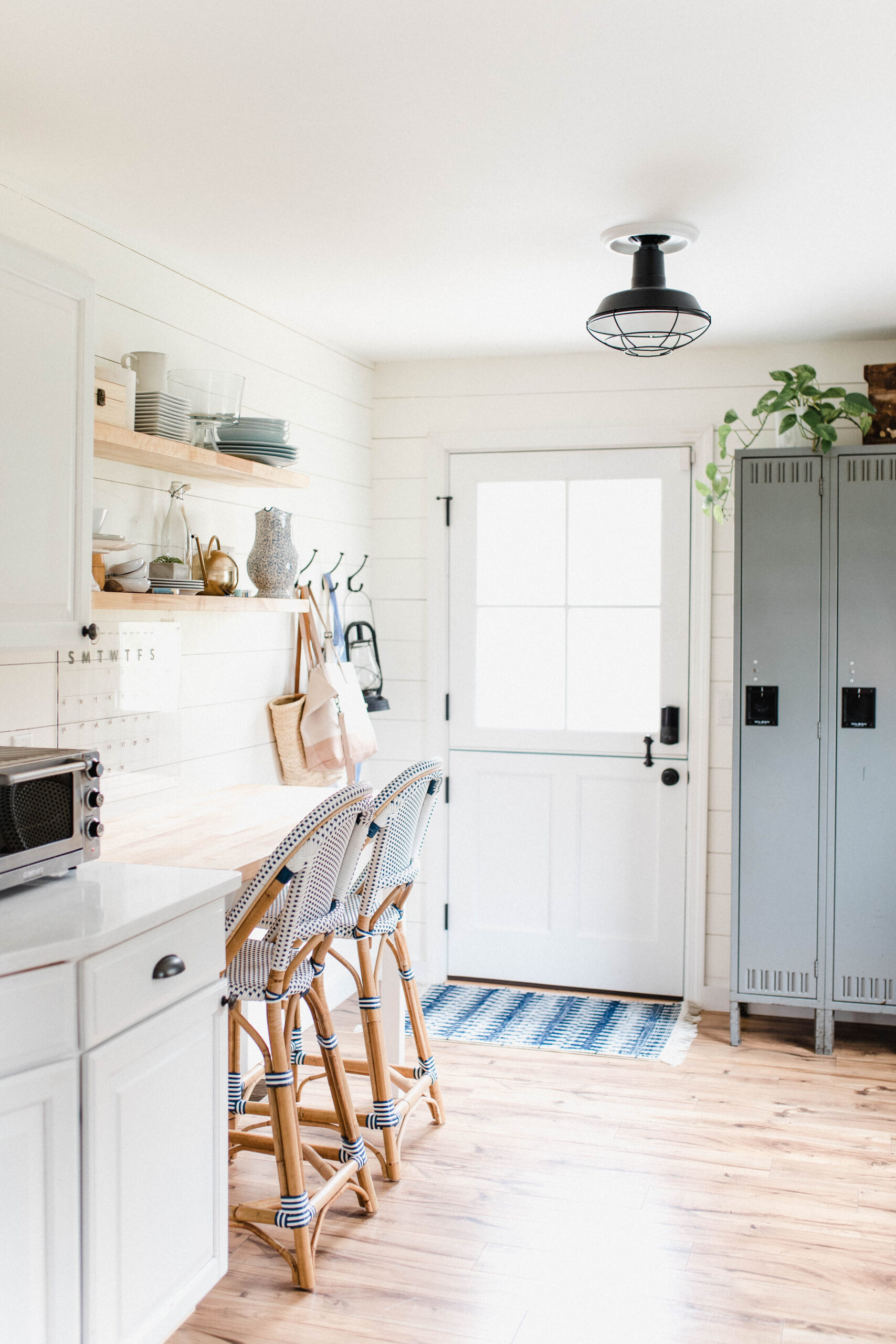 Connecticut life and style blogger Lauren McBride shares her farmhouse inspired kitchen in her coastal farmhouse home, including source list.