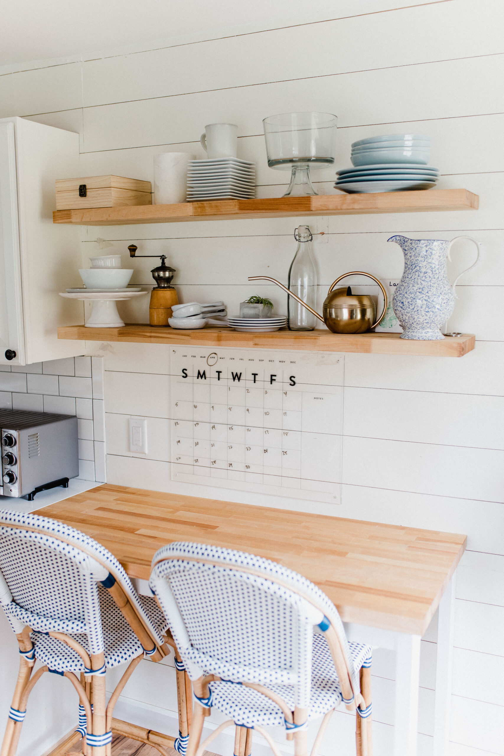 Connecticut life and style blogger Lauren McBride shares her farmhouse inspired kitchen in her coastal farmhouse home, including source list.