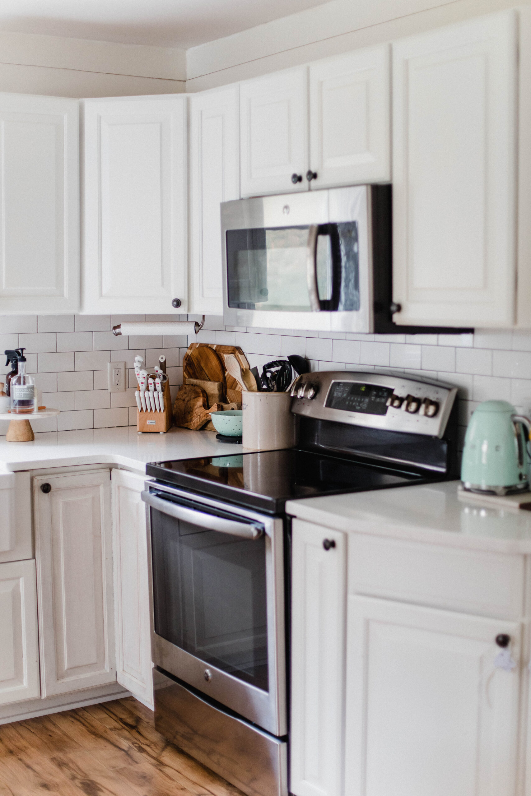 Connecticut life and style blogger Lauren McBride shares her farmhouse inspired kitchen in her coastal farmhouse home, including source list.